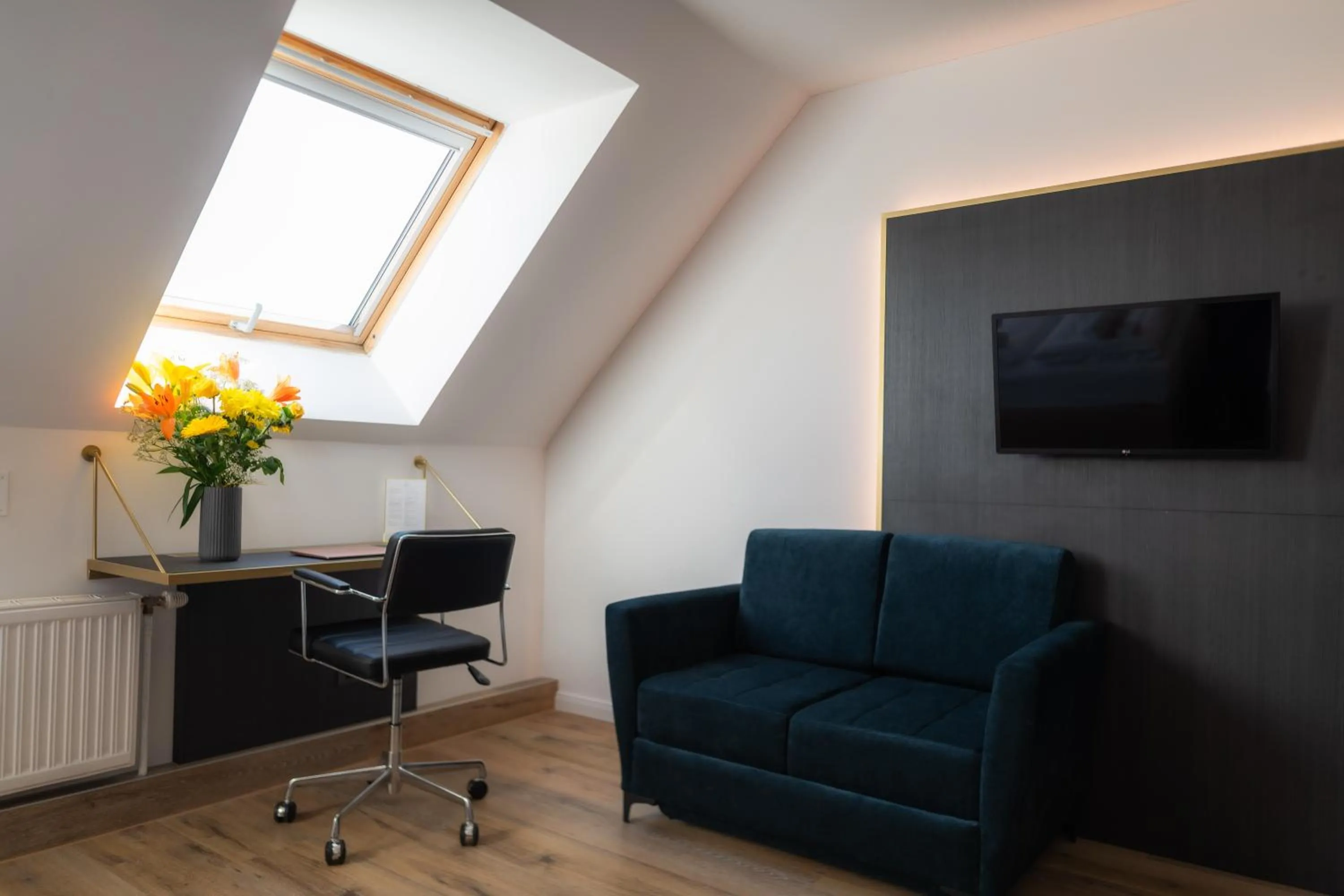 Communal lounge/ TV room in Florum Hotel