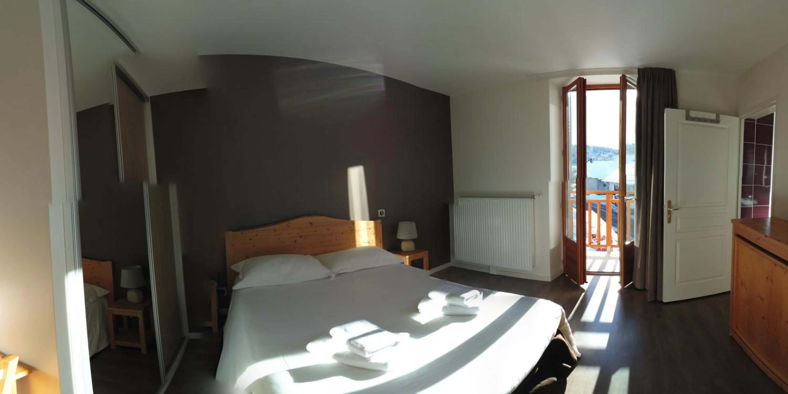 Photo of the whole room, Bed in Hôtel du Soleil
