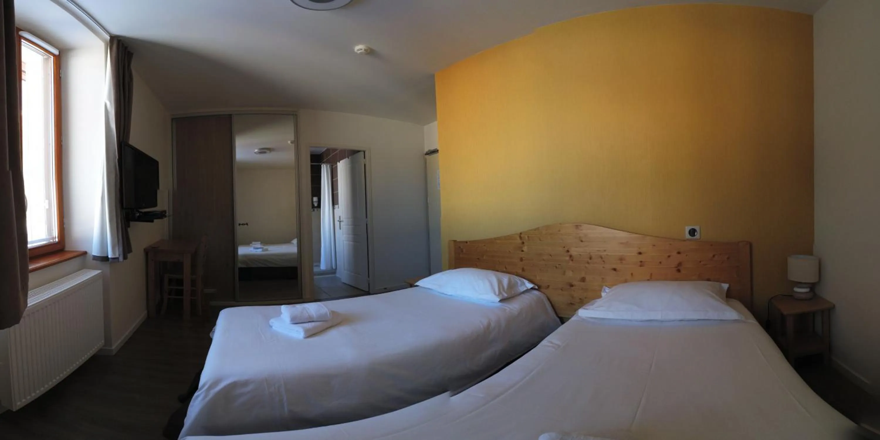 Photo of the whole room, Bed in Hôtel du Soleil