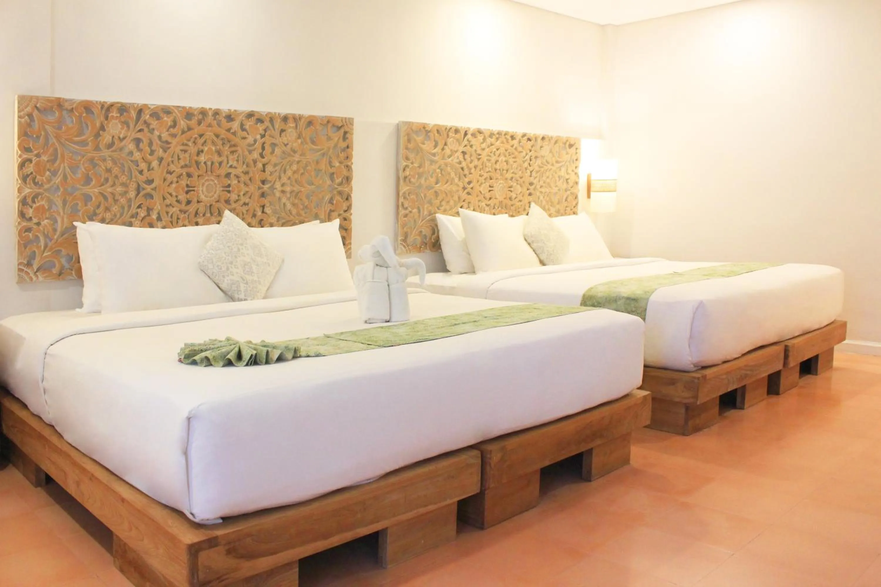 Bed in AlamKulkul Boutique Resort