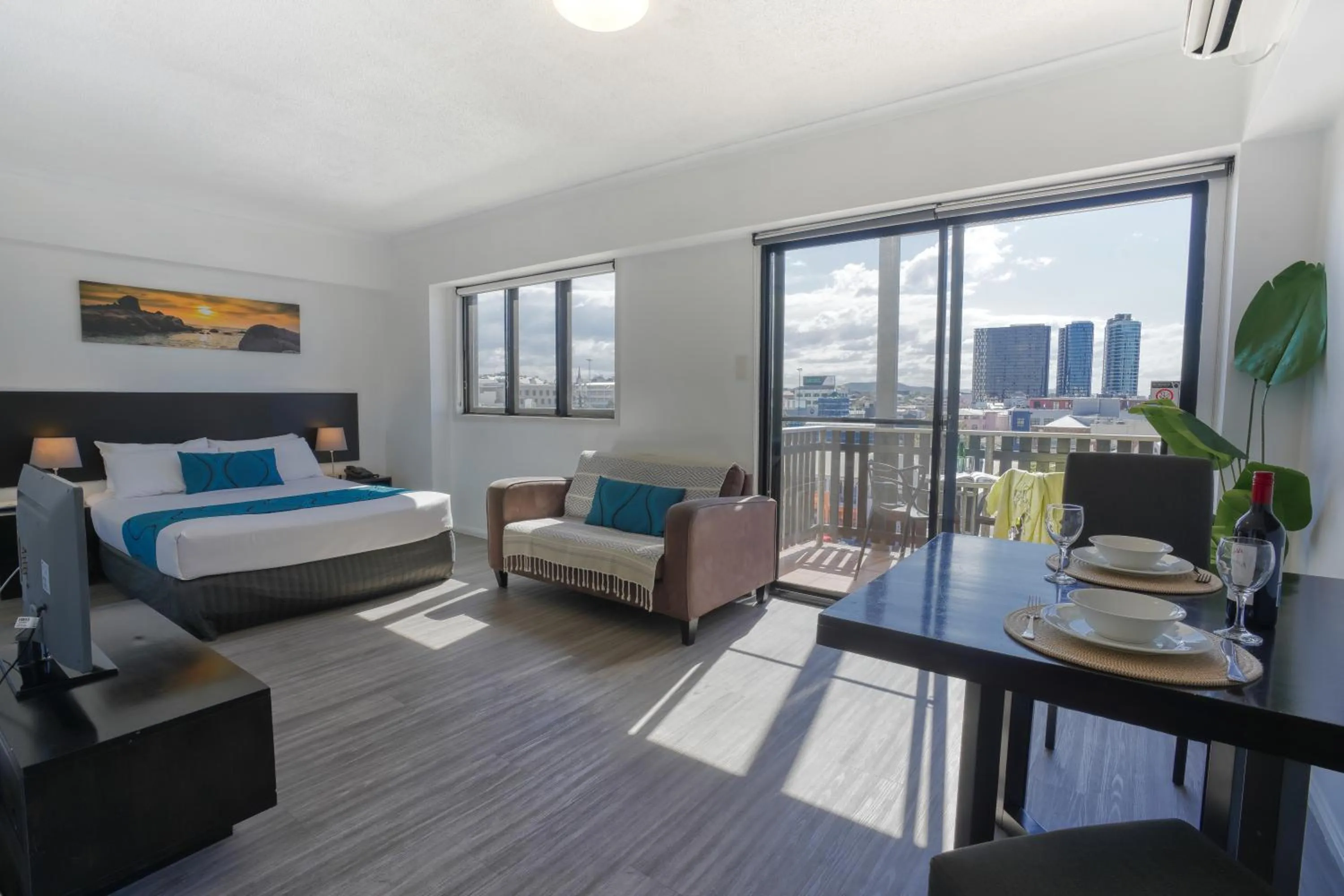 Living room, Bed in Central Brunswick Apartment Hotel