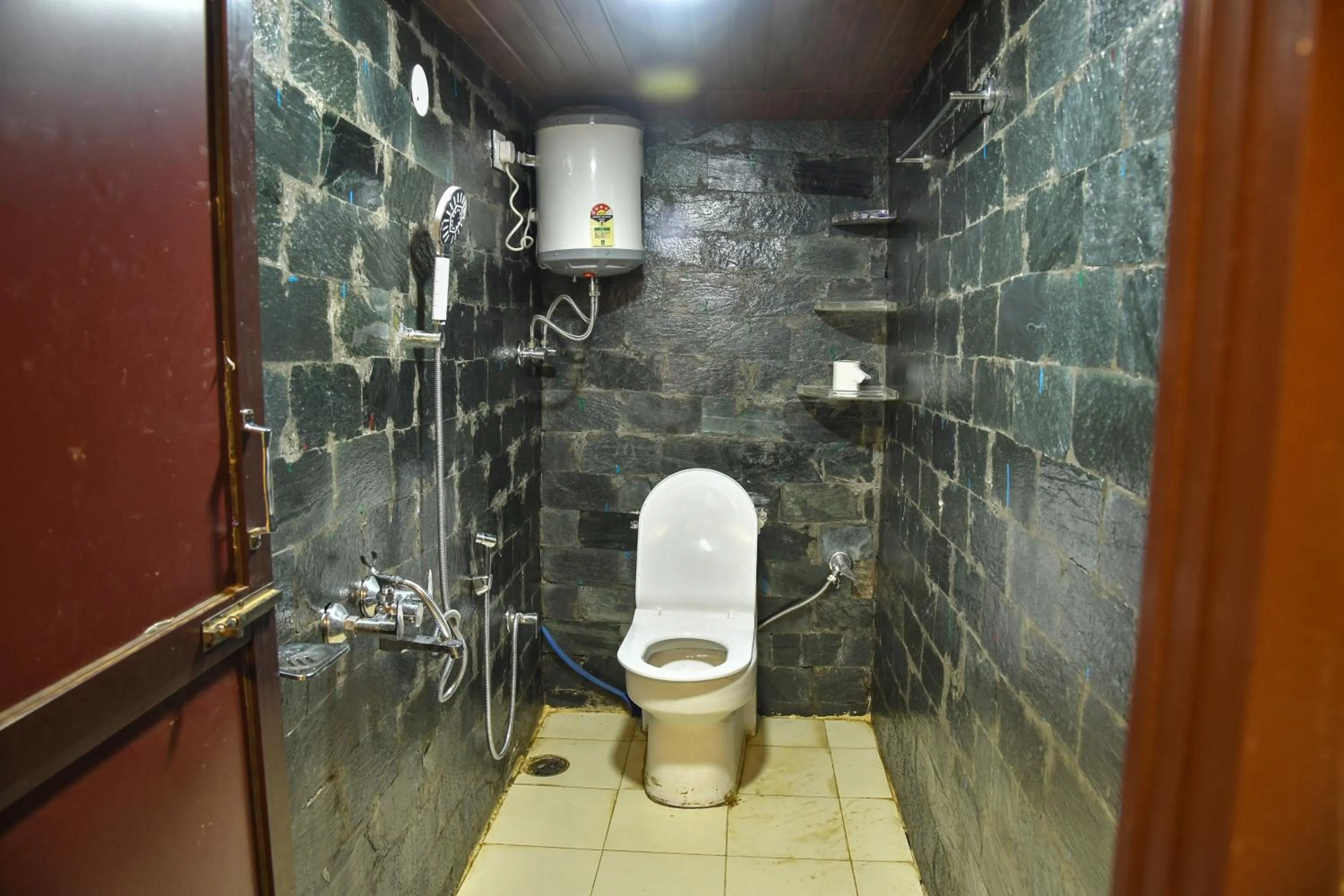 Bathroom in Monkey Mud House and Camps, Bir