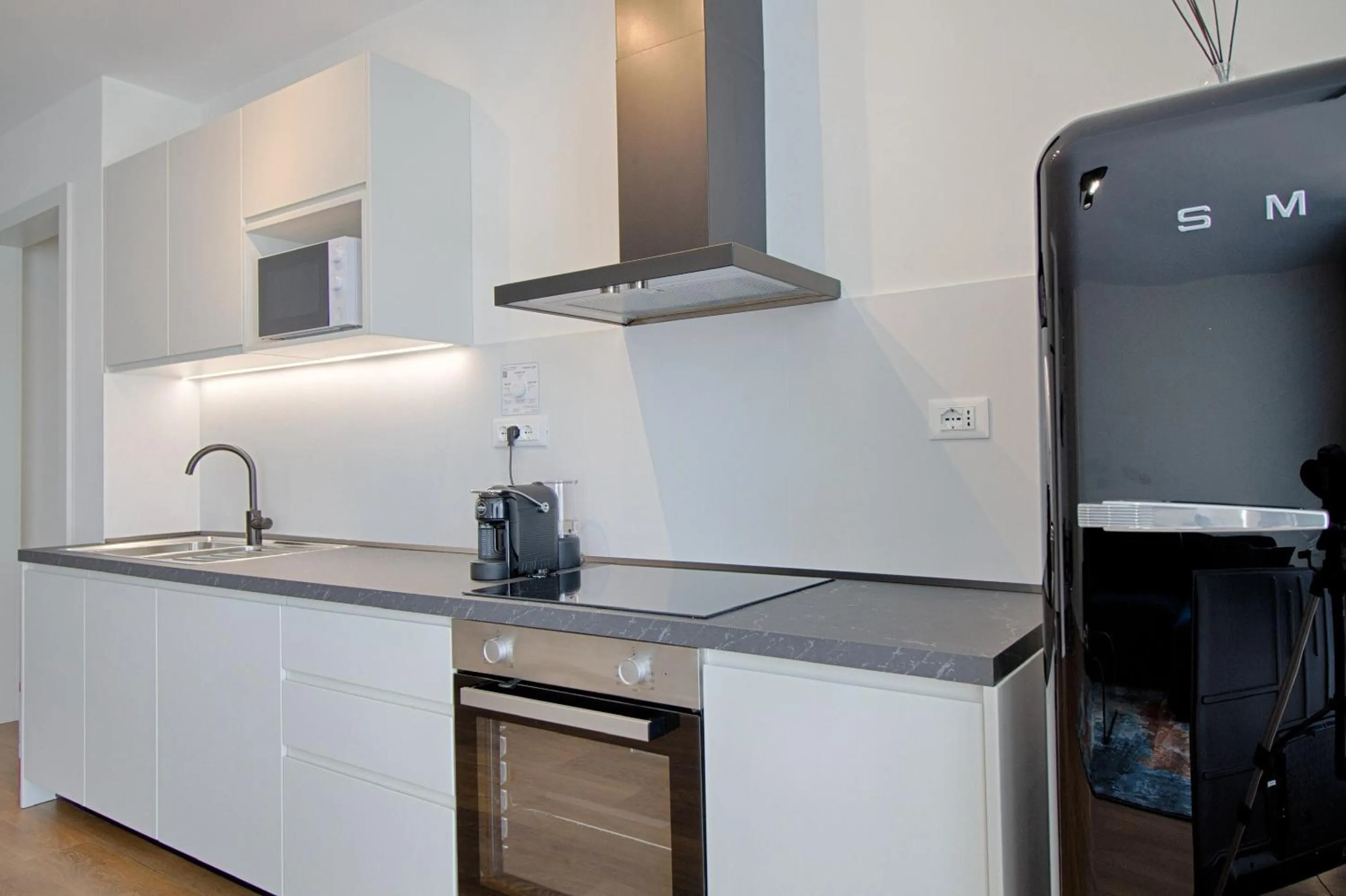 TV and multimedia in The Rooms Serviced Apartments Tirana