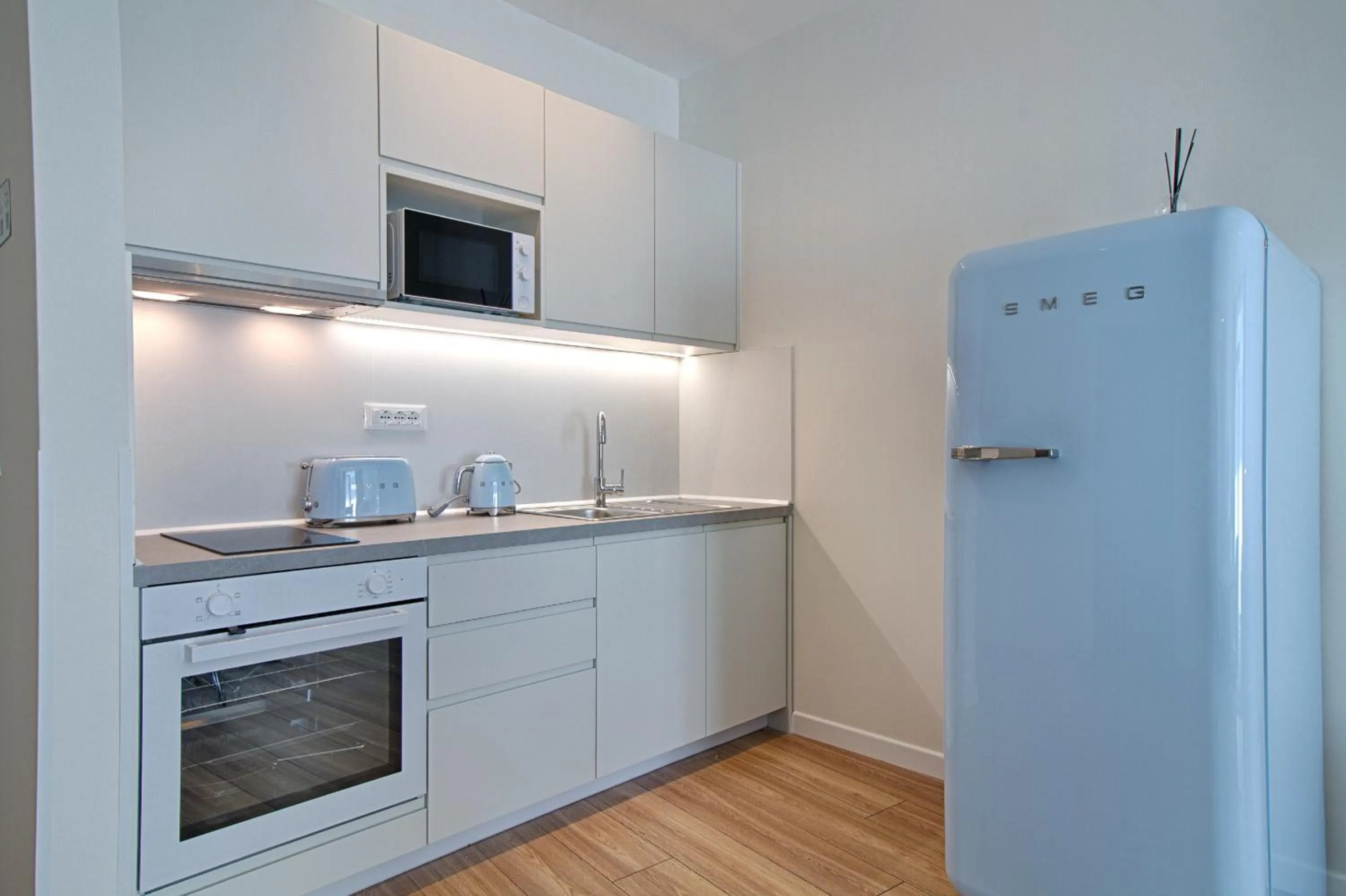 TV and multimedia in The Rooms Serviced Apartments Tirana