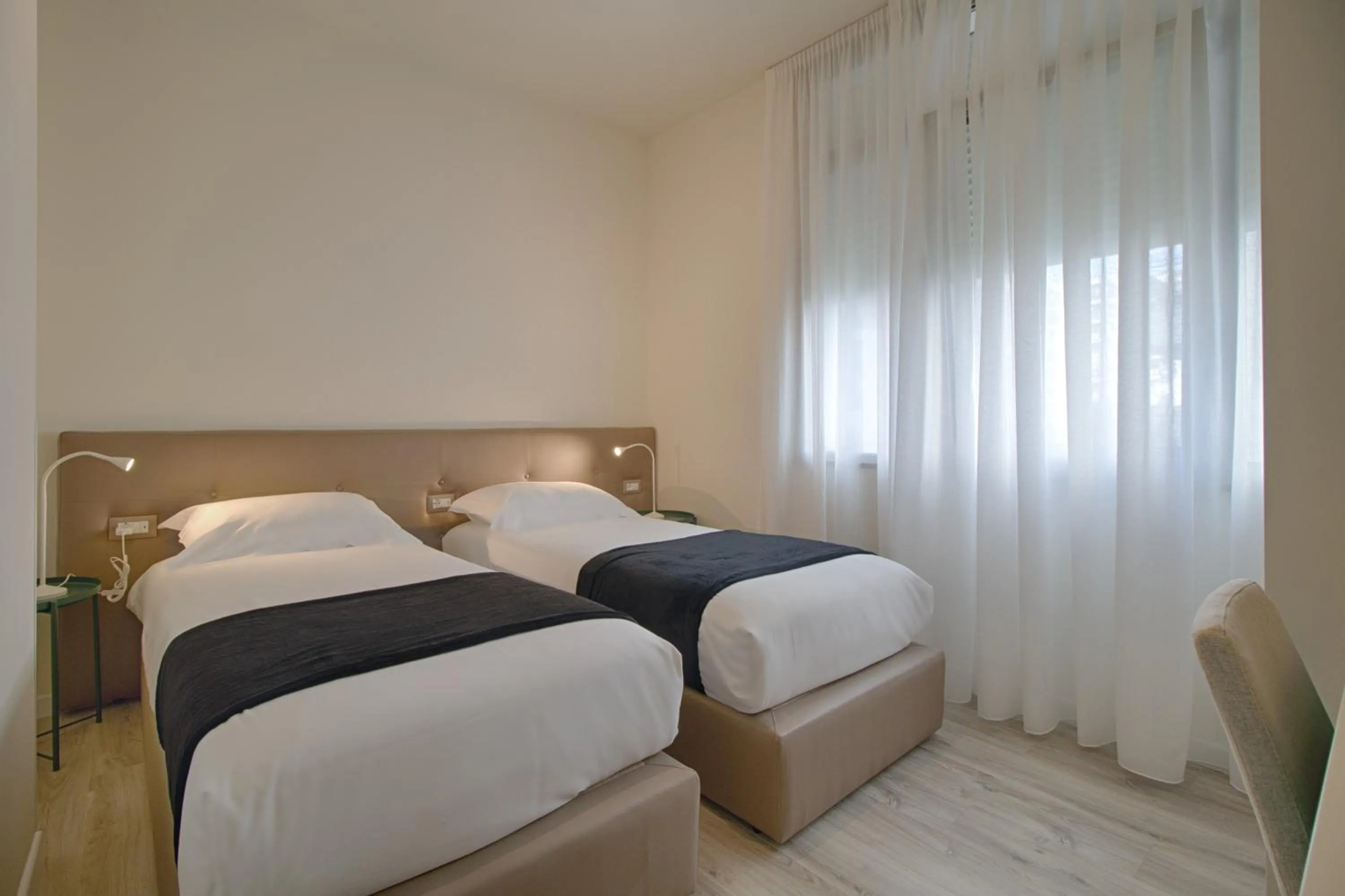 Bathroom, Bed in The Rooms Serviced Apartments Tirana