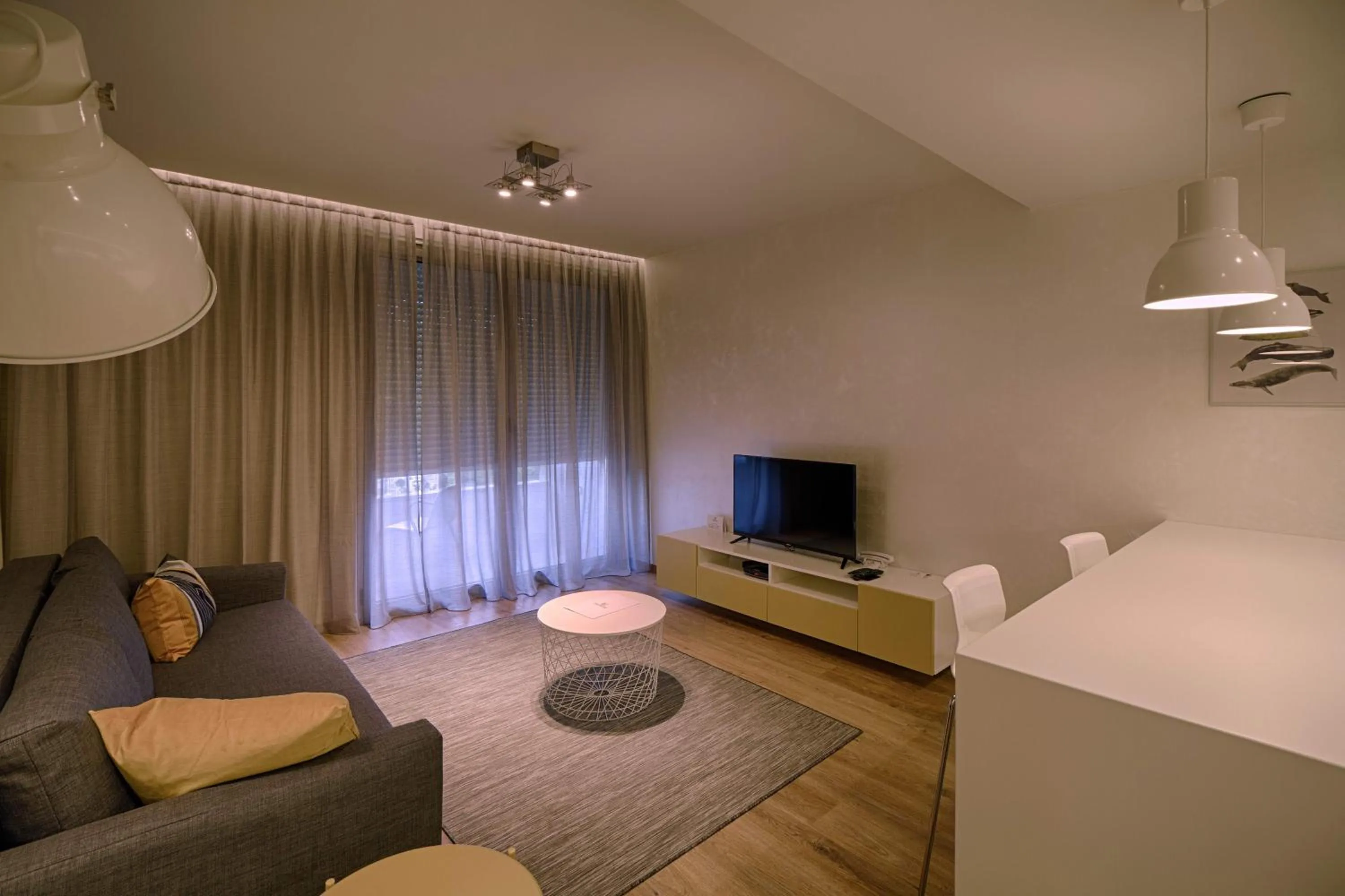 TV and multimedia in The Rooms Serviced Apartments Tirana
