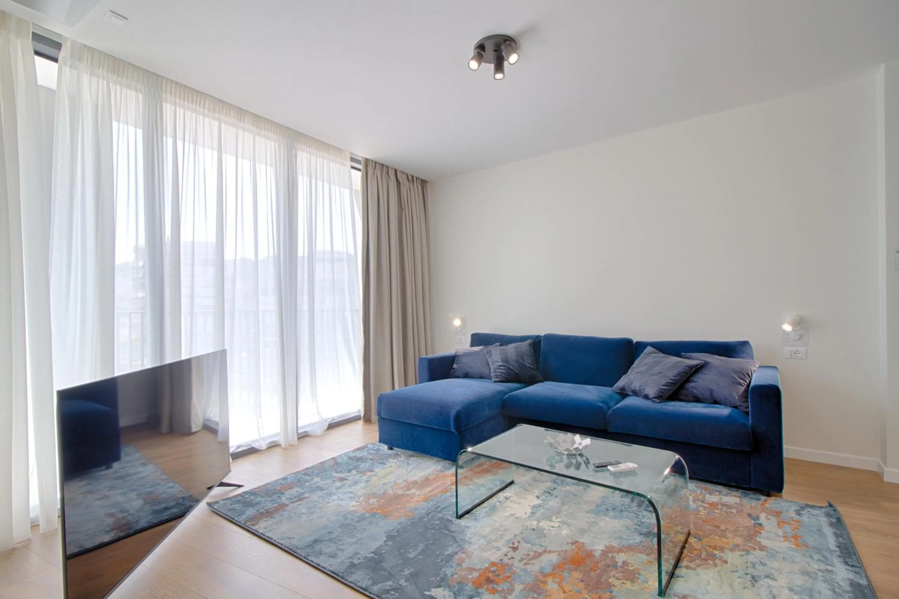 Communal lounge/ TV room in The Rooms Serviced Apartments Tirana