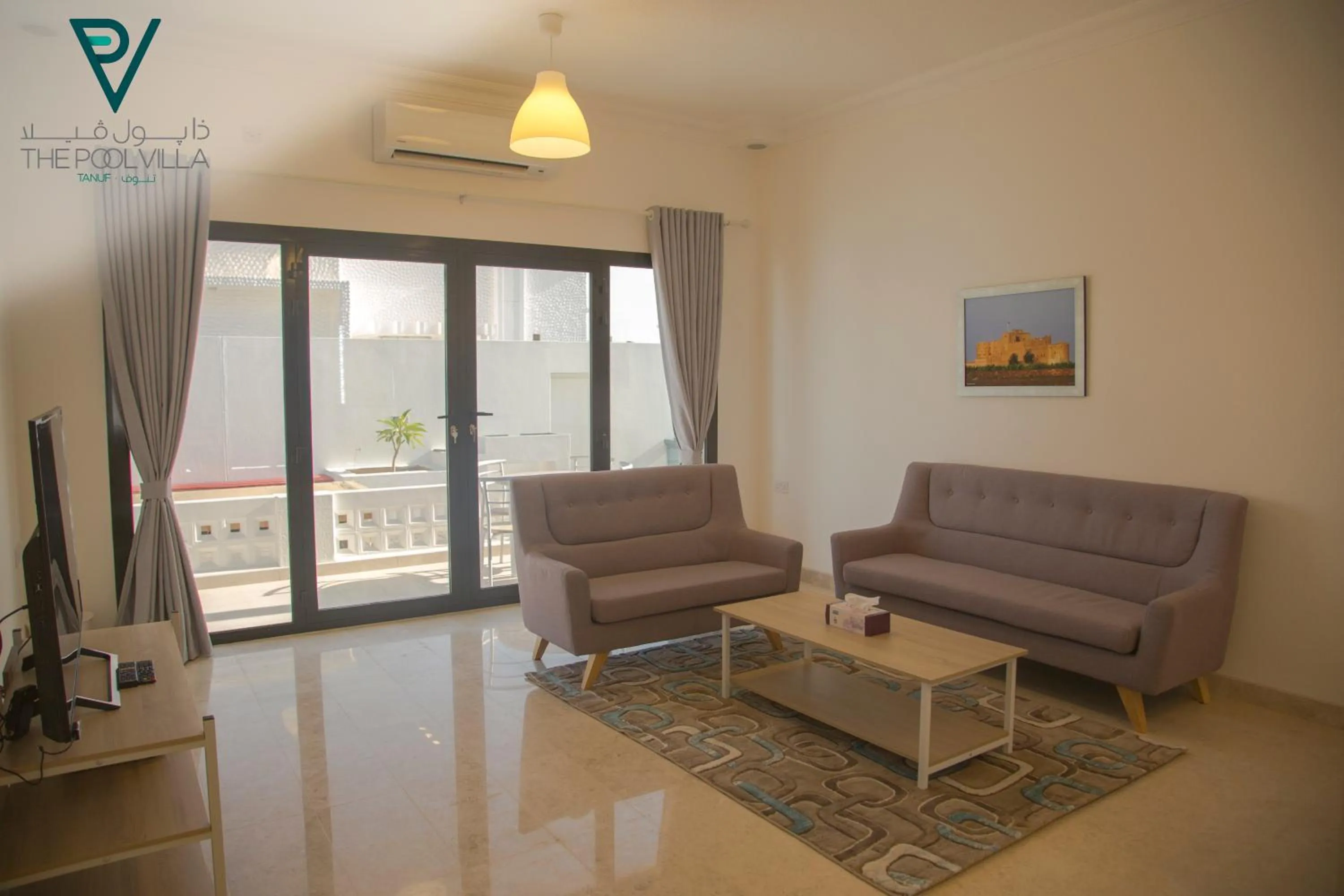 Living room in THE POOL VILLA - TANUF