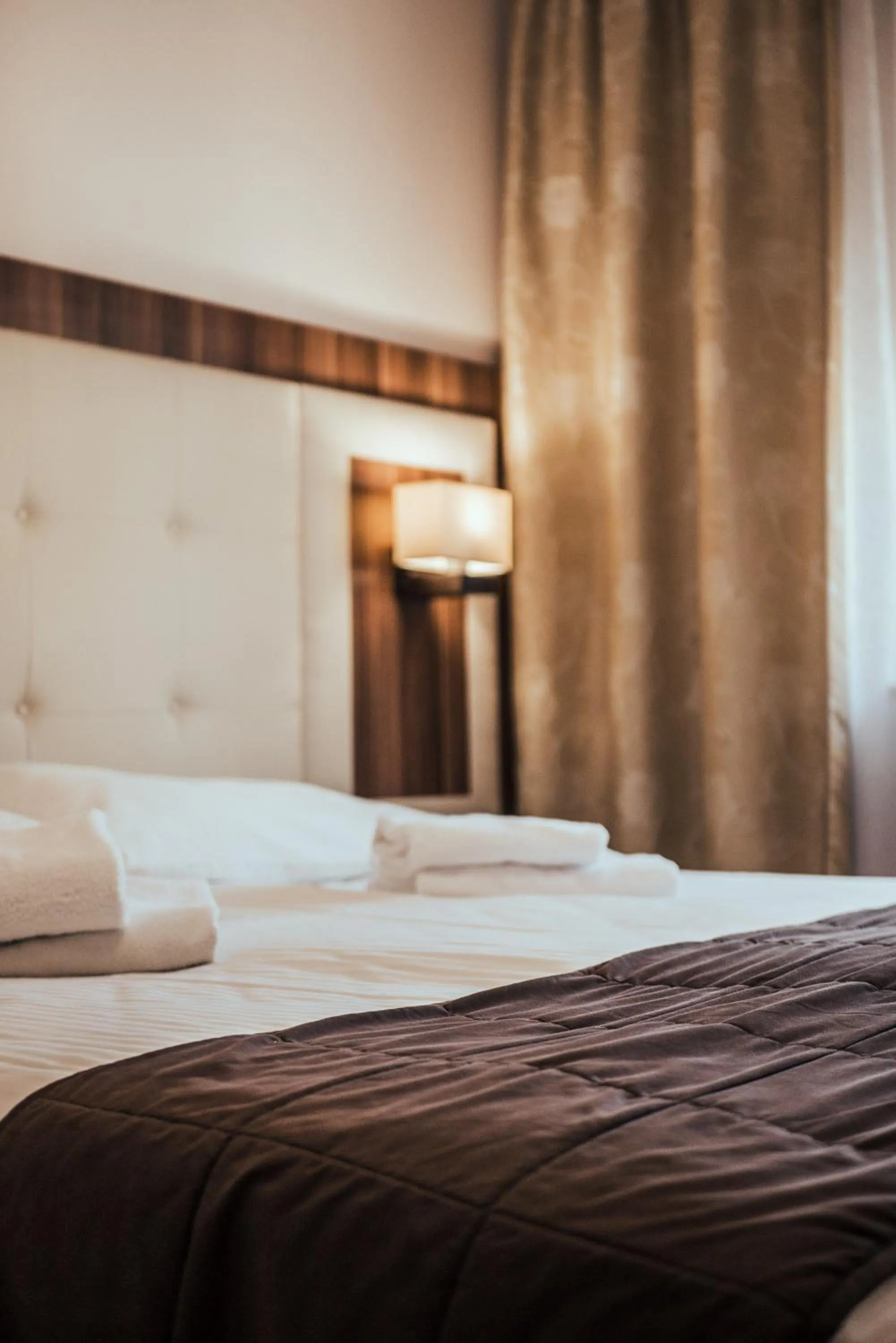 Bed in Cumulus Hotel