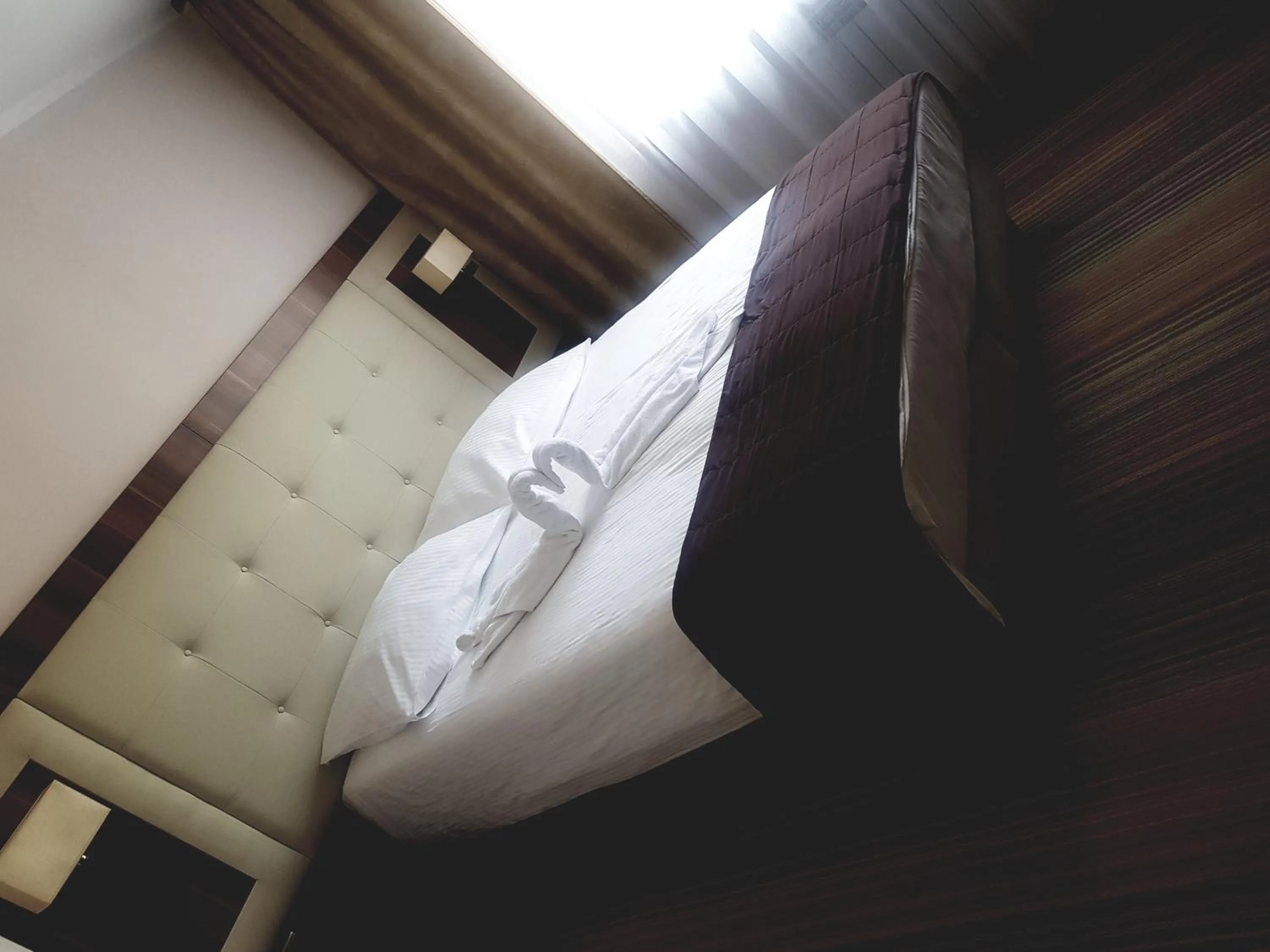Bed in Cumulus Hotel