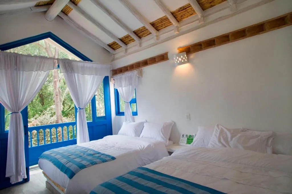 Bed in HOTEL & CABAÑAS CASHILUNA