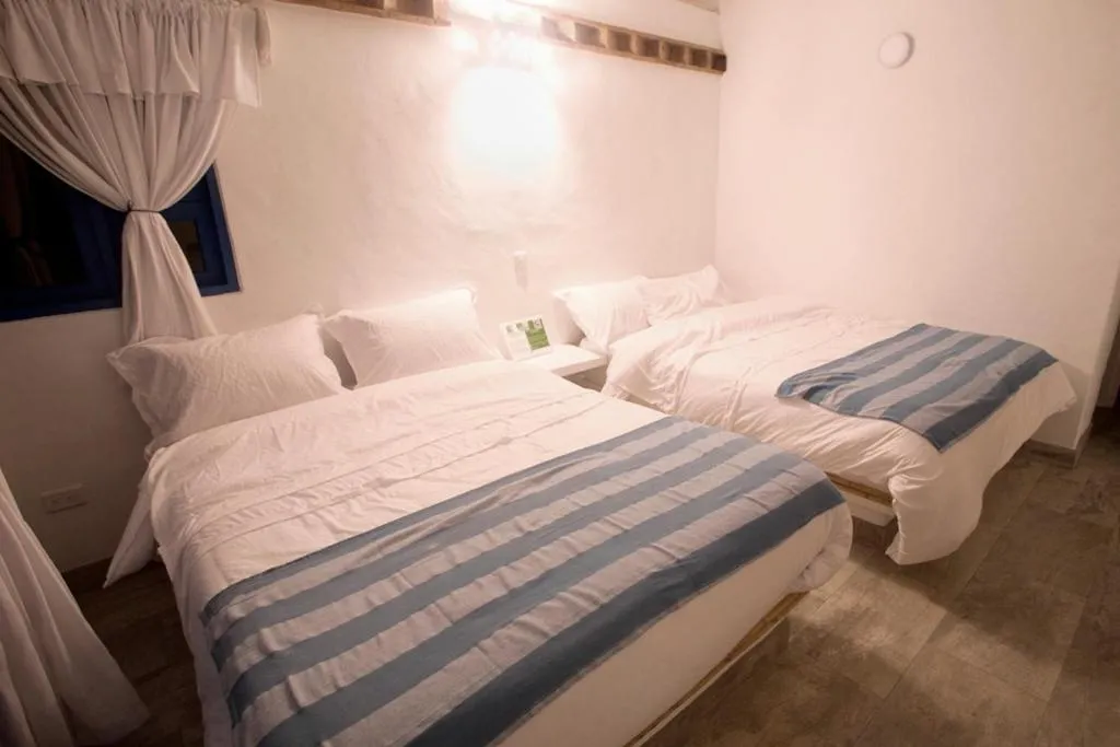 Bed in HOTEL & CABAÑAS CASHILUNA