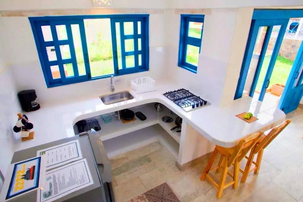 Kitchen or kitchenette in HOTEL & CABAÑAS CASHILUNA
