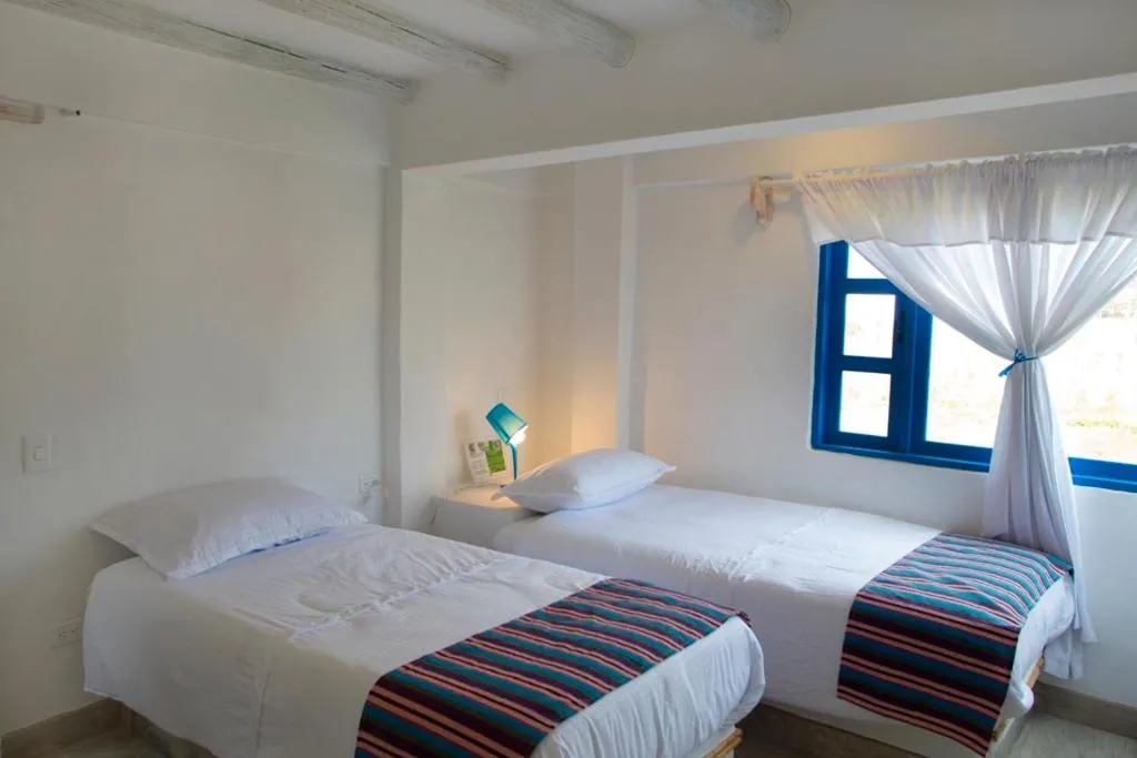 Bed in HOTEL & CABAÑAS CASHILUNA