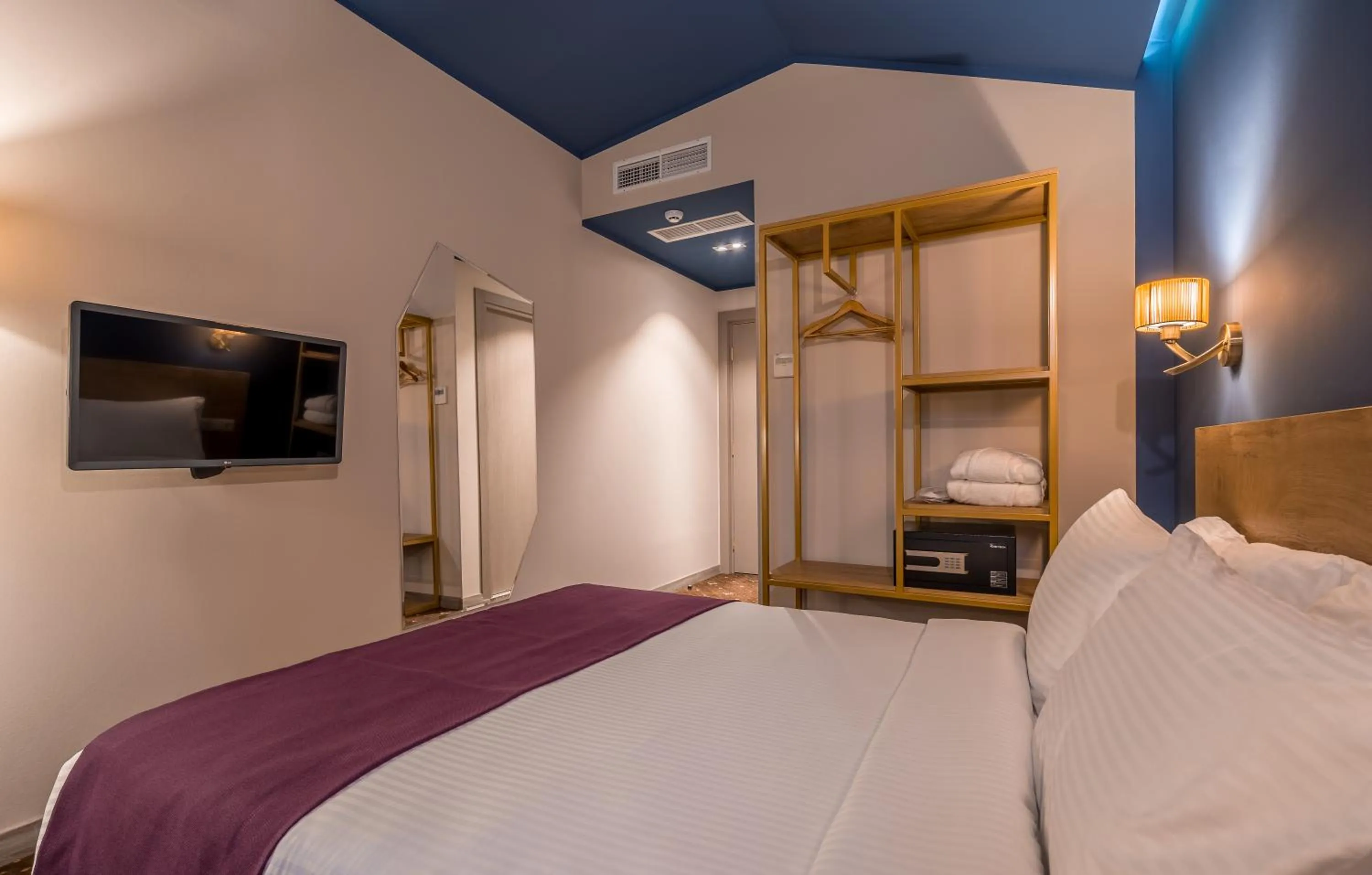 Bed in Gladius Inn Boutique Hotel by DNT Group