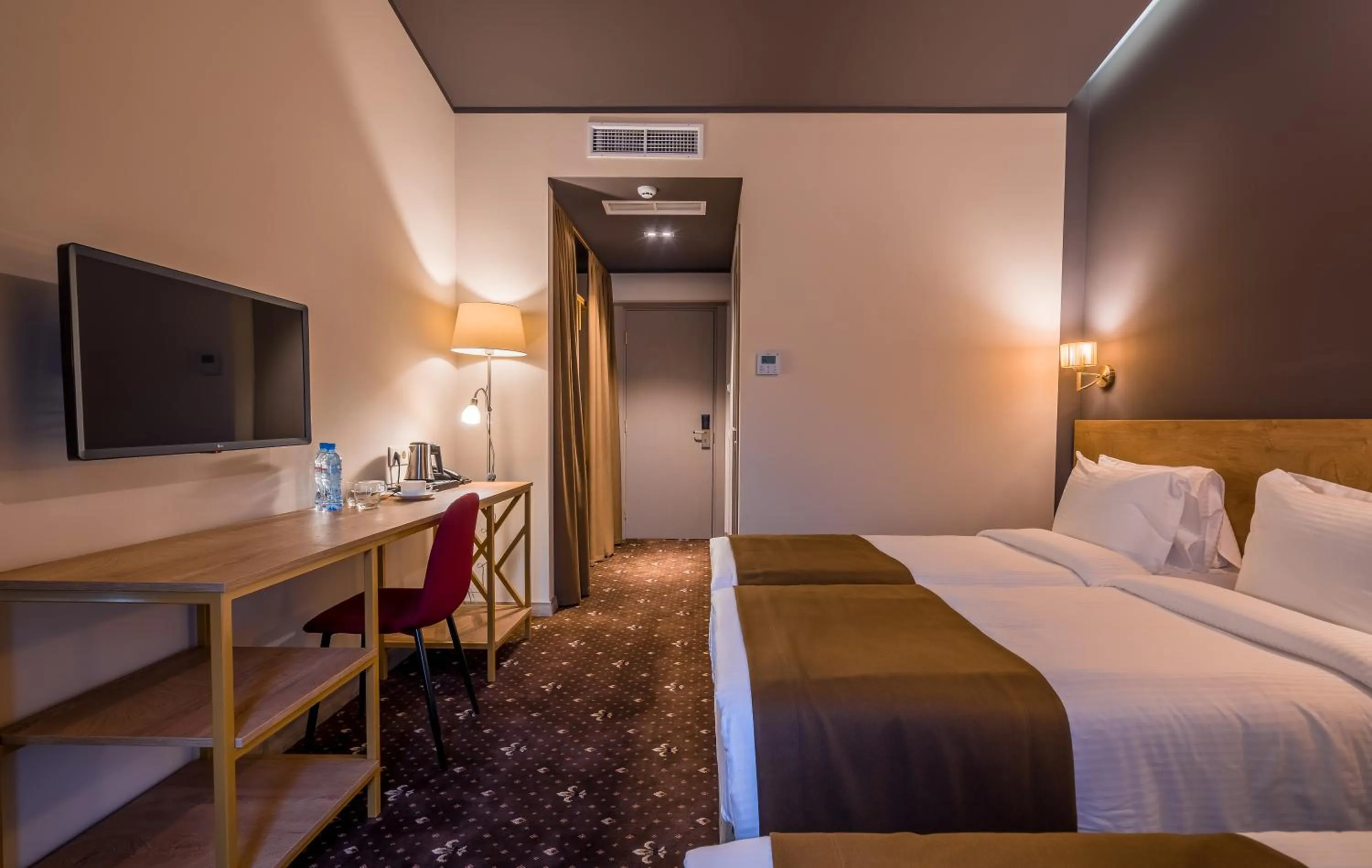 Bed in Gladius Inn Boutique Hotel by DNT Group