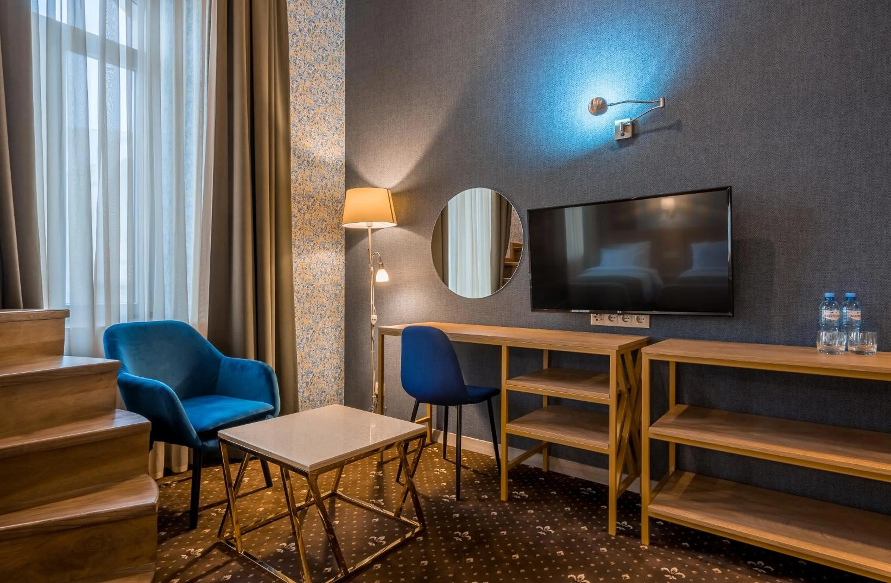 TV and multimedia in Gladius Inn Boutique Hotel by DNT Group