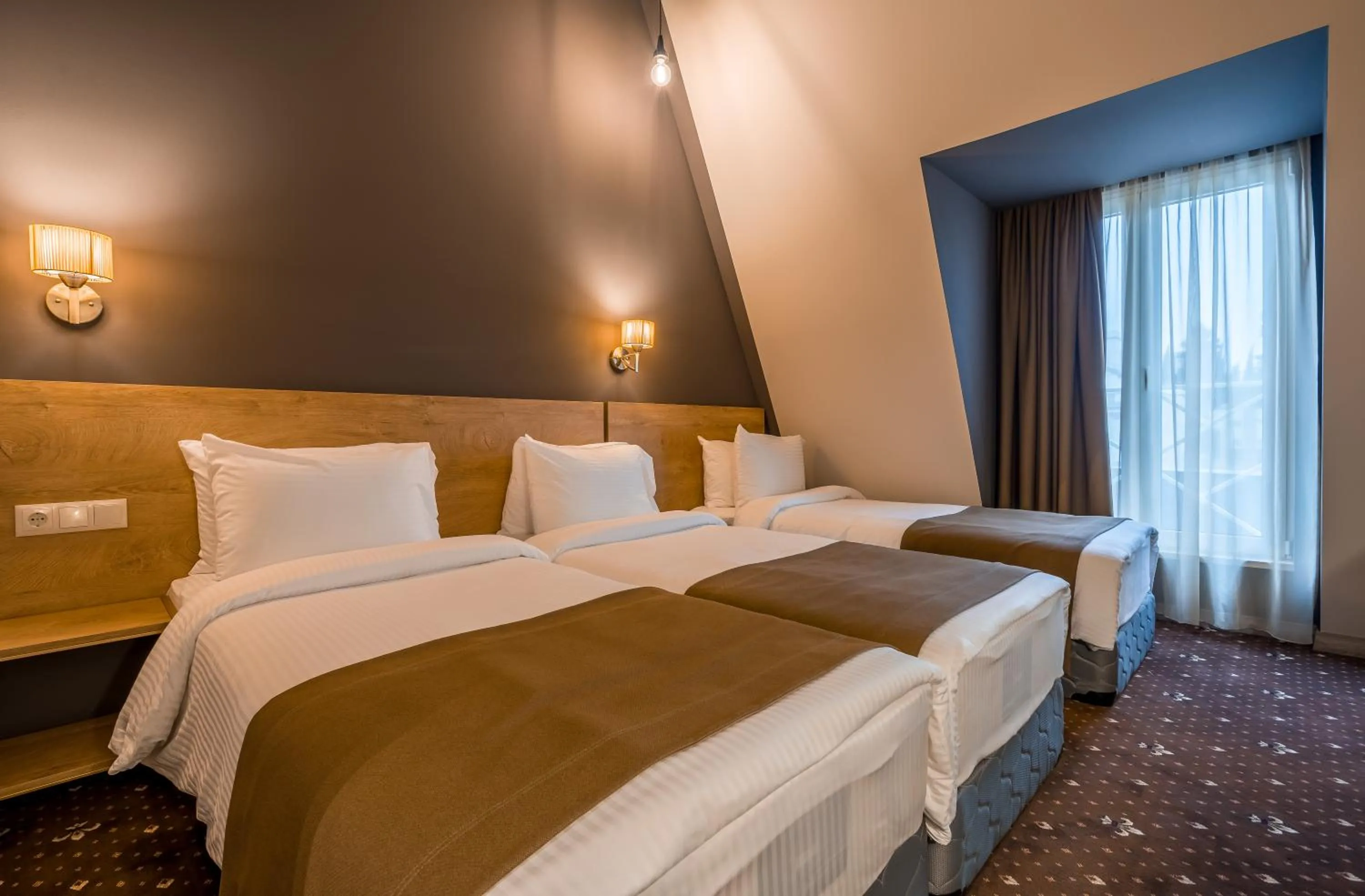 Bed in Gladius Inn Boutique Hotel by DNT Group