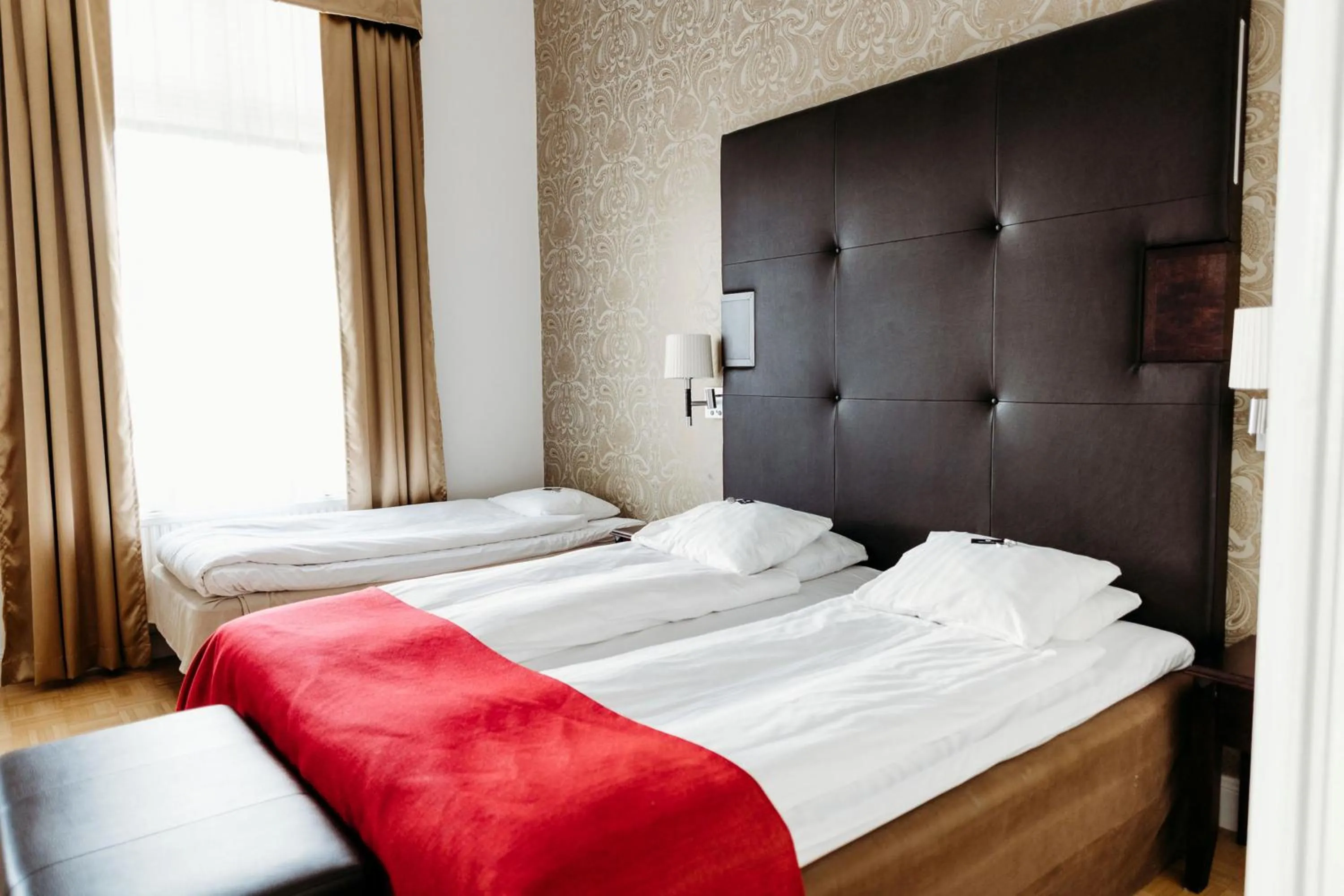 Bed in Vimmerby Stadshotell, WorldHotels Crafted