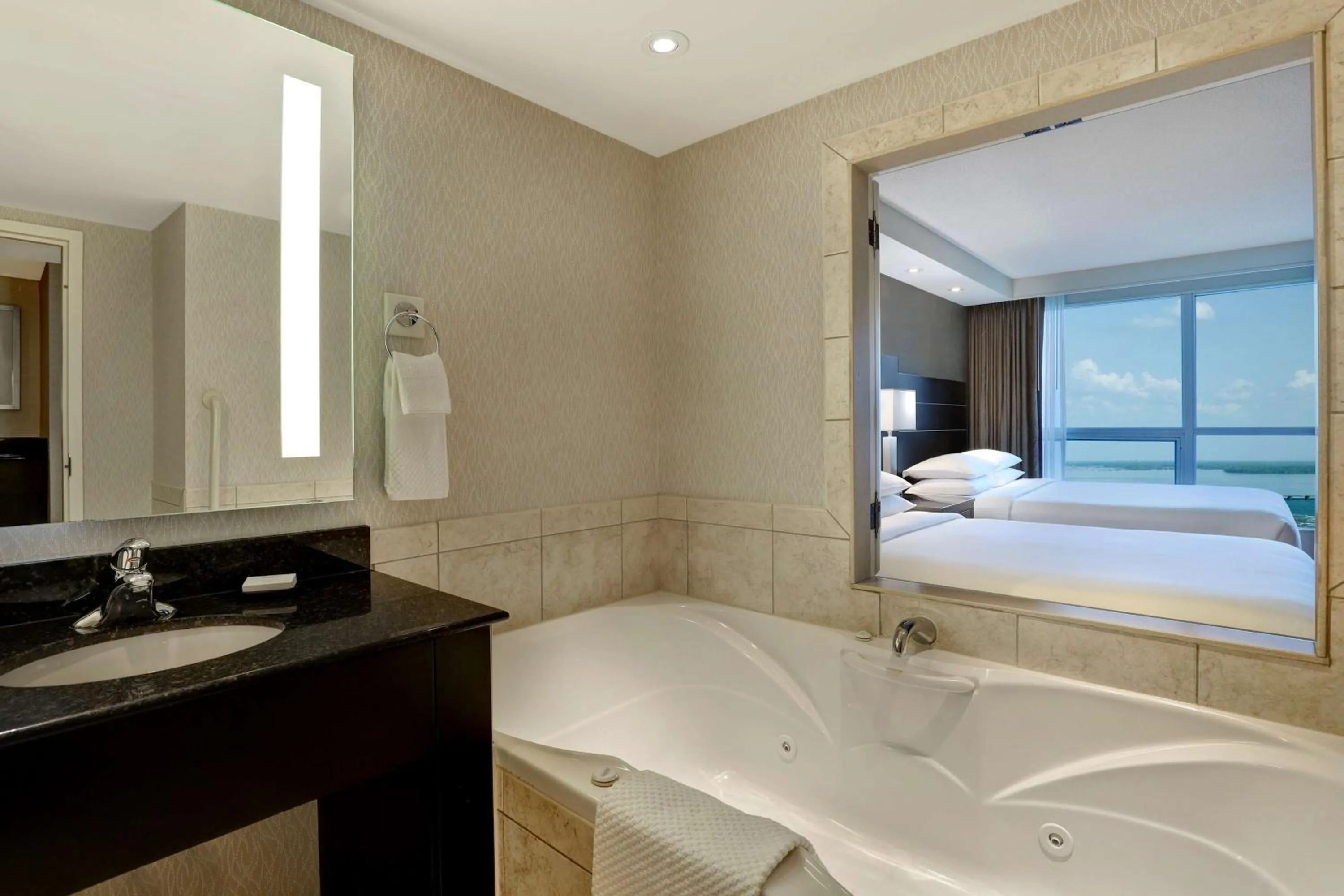 Bathroom, Bed in Embassy Suites by Hilton Niagara Falls/ Fallsview
