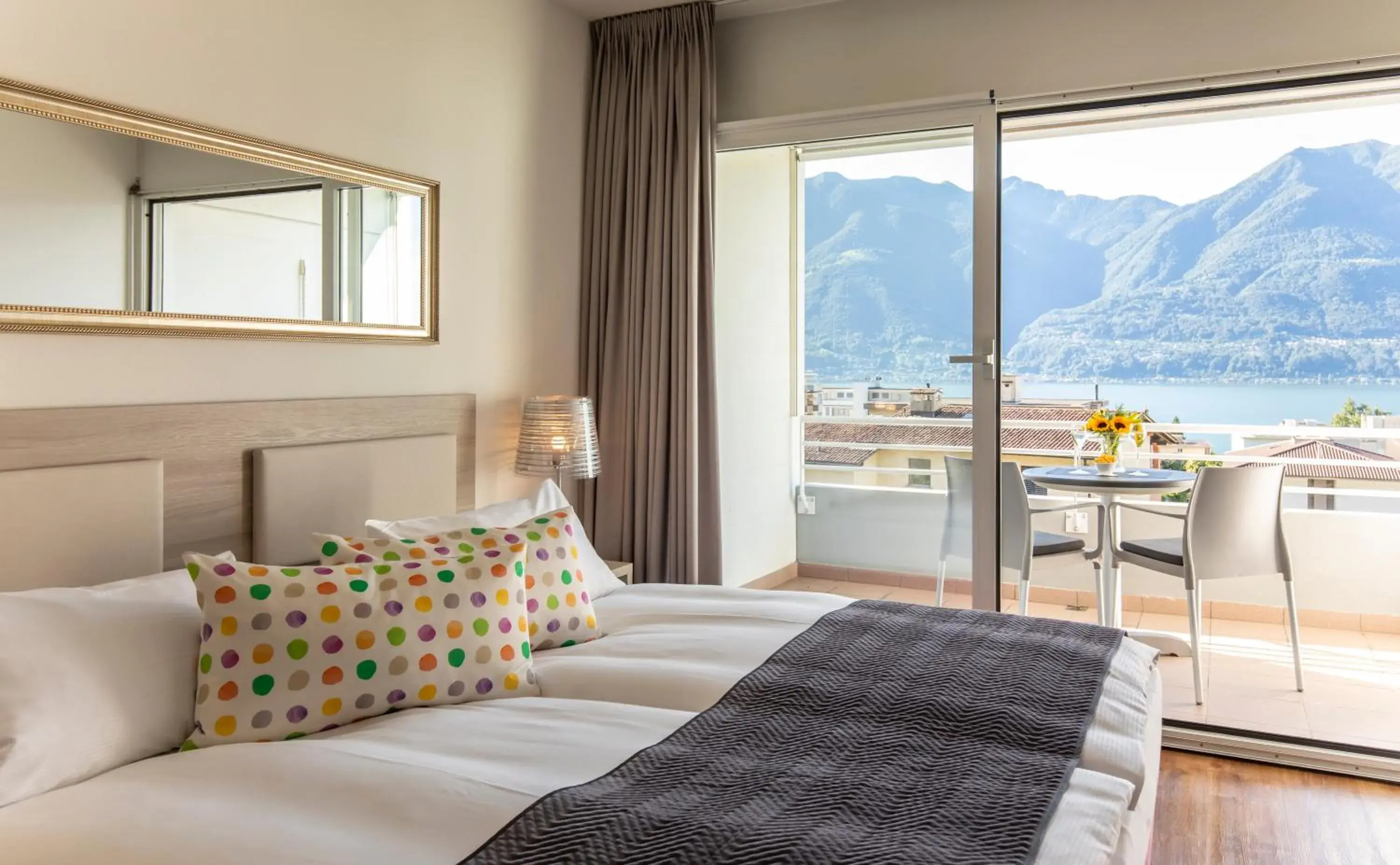 Double Room with Balcony and Lake View in Smart-HOTEL MINUSIO, a Swiss Quality Hotel Double Room with Balcony and Lake View in Smart-HOTEL MINUSIO, a Swiss Quality Hotel