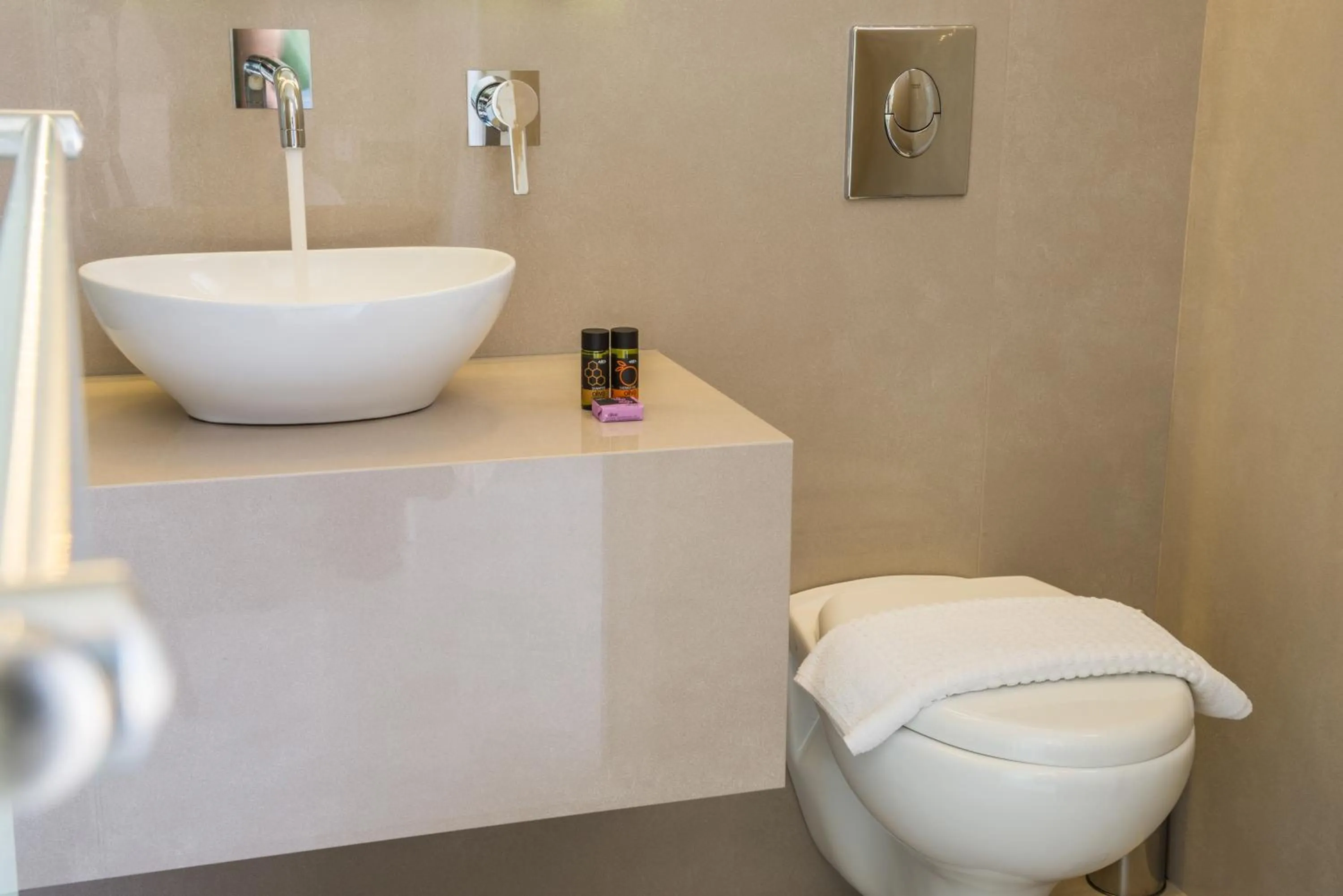 Toilet in Forum Suites