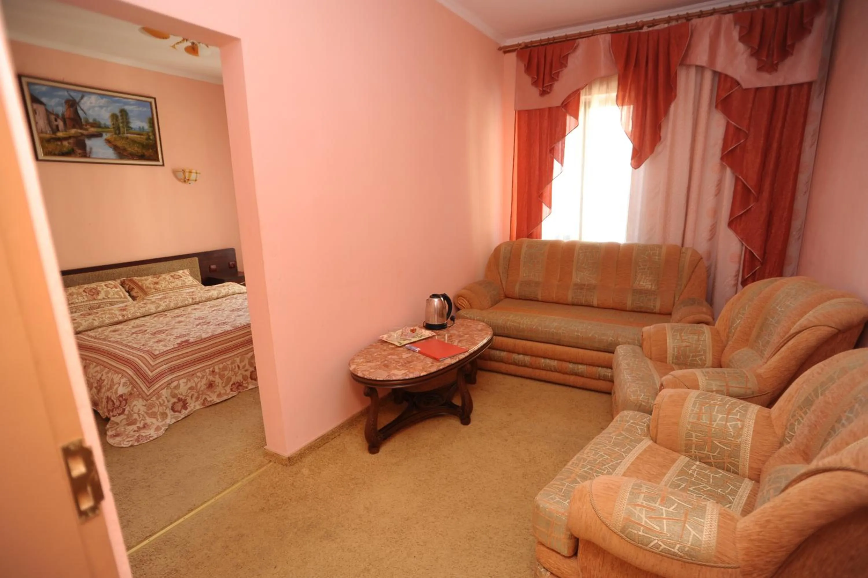 Communal lounge/ TV room, Bed in Hotel Star