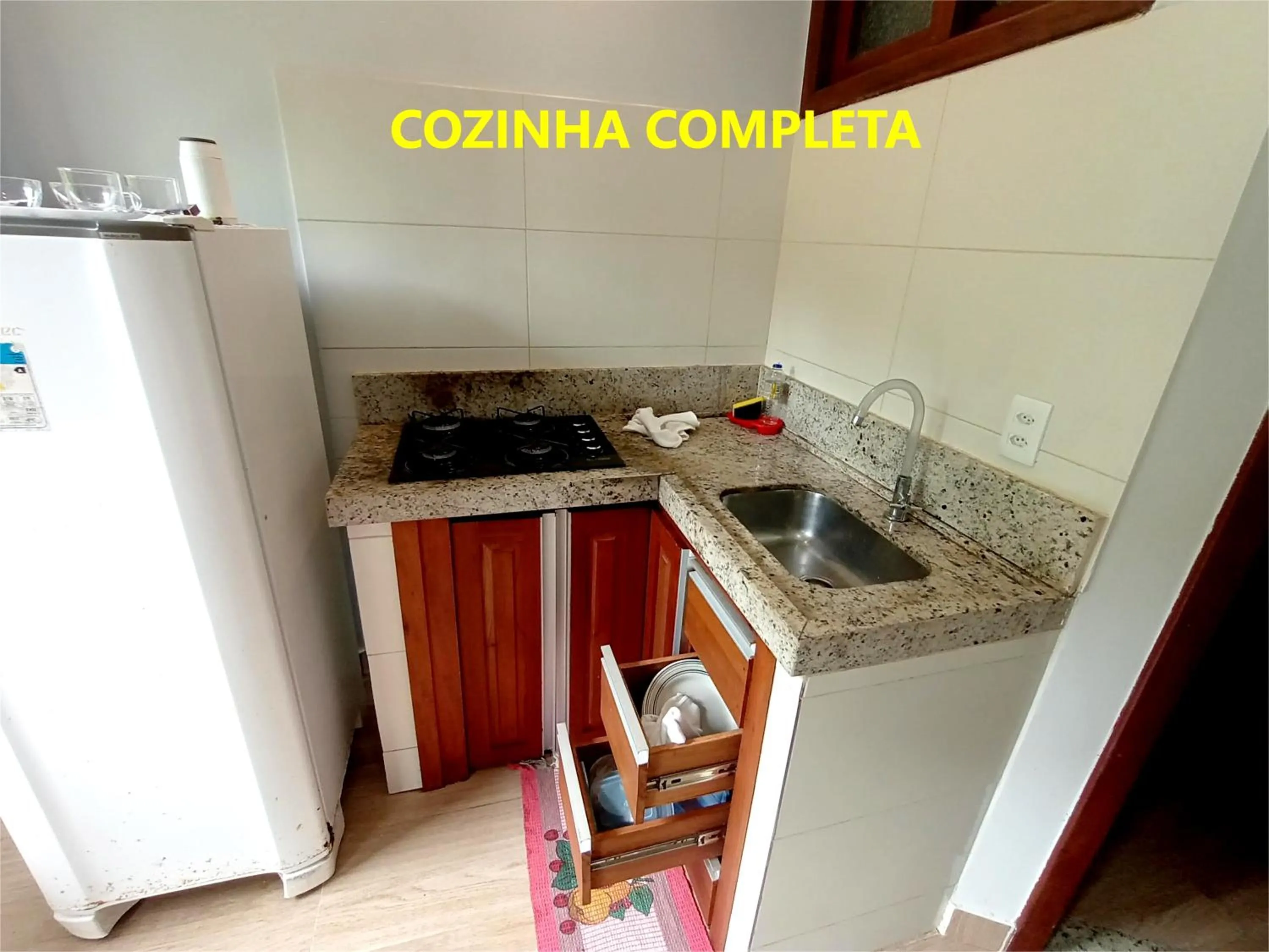 Kitchen or kitchenette in Pousada Lagoa Flat
