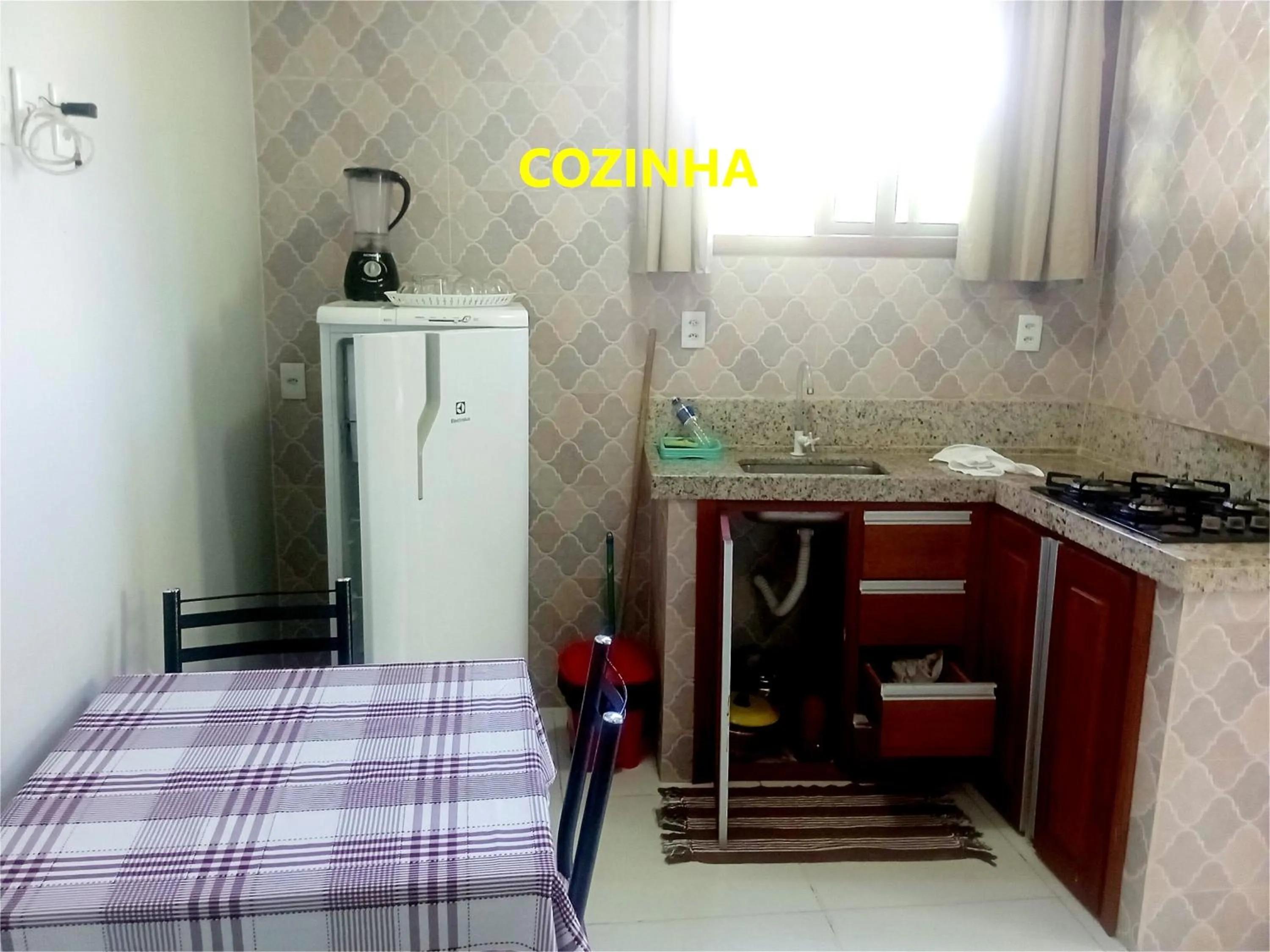 Kitchen or kitchenette in Pousada Lagoa Flat