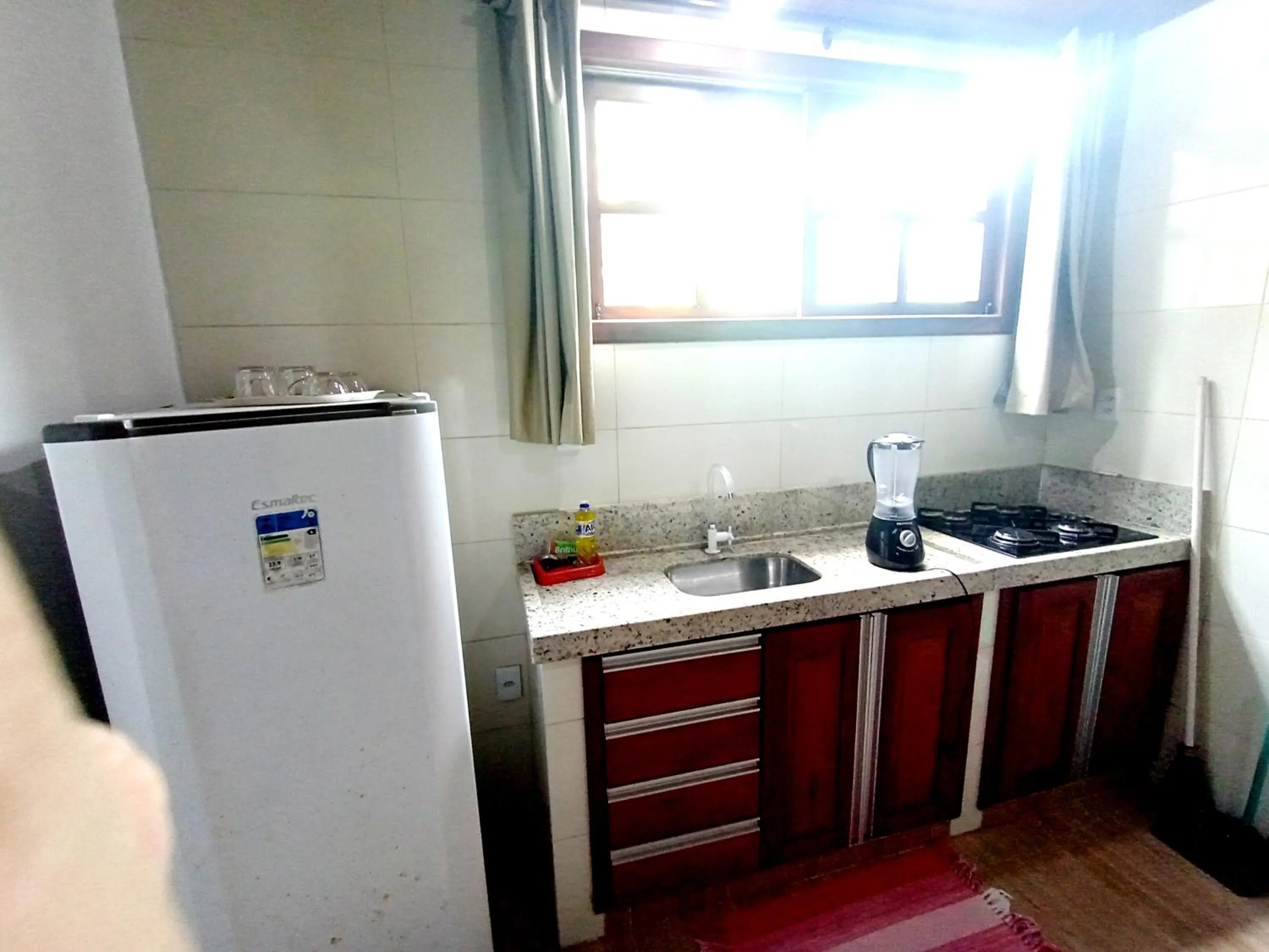 Kitchen or kitchenette in Pousada Lagoa Flat