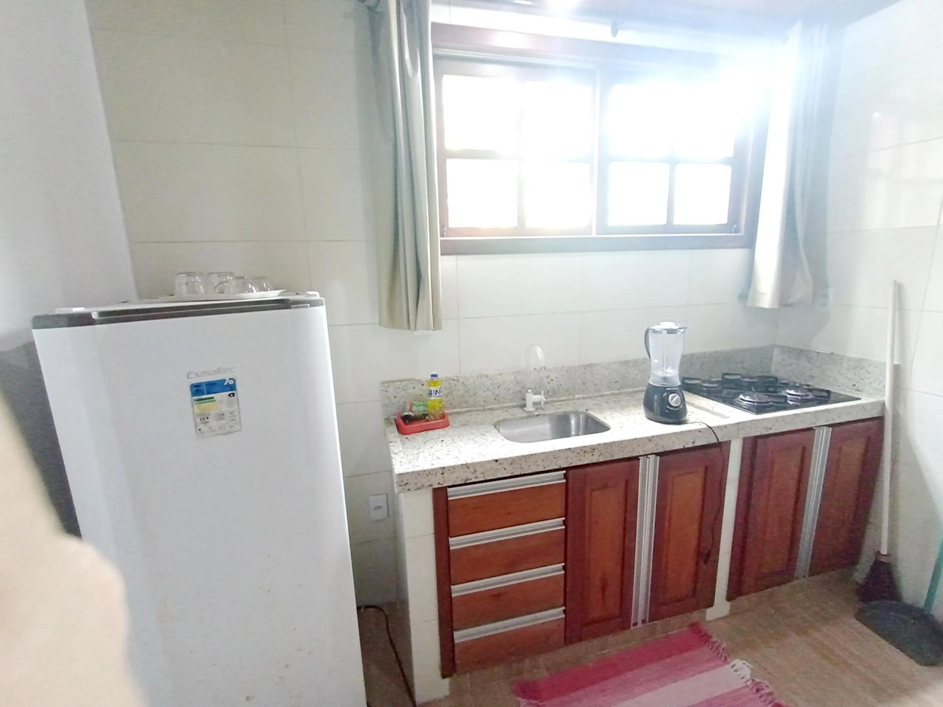 Kitchen or kitchenette in Pousada Lagoa Flat