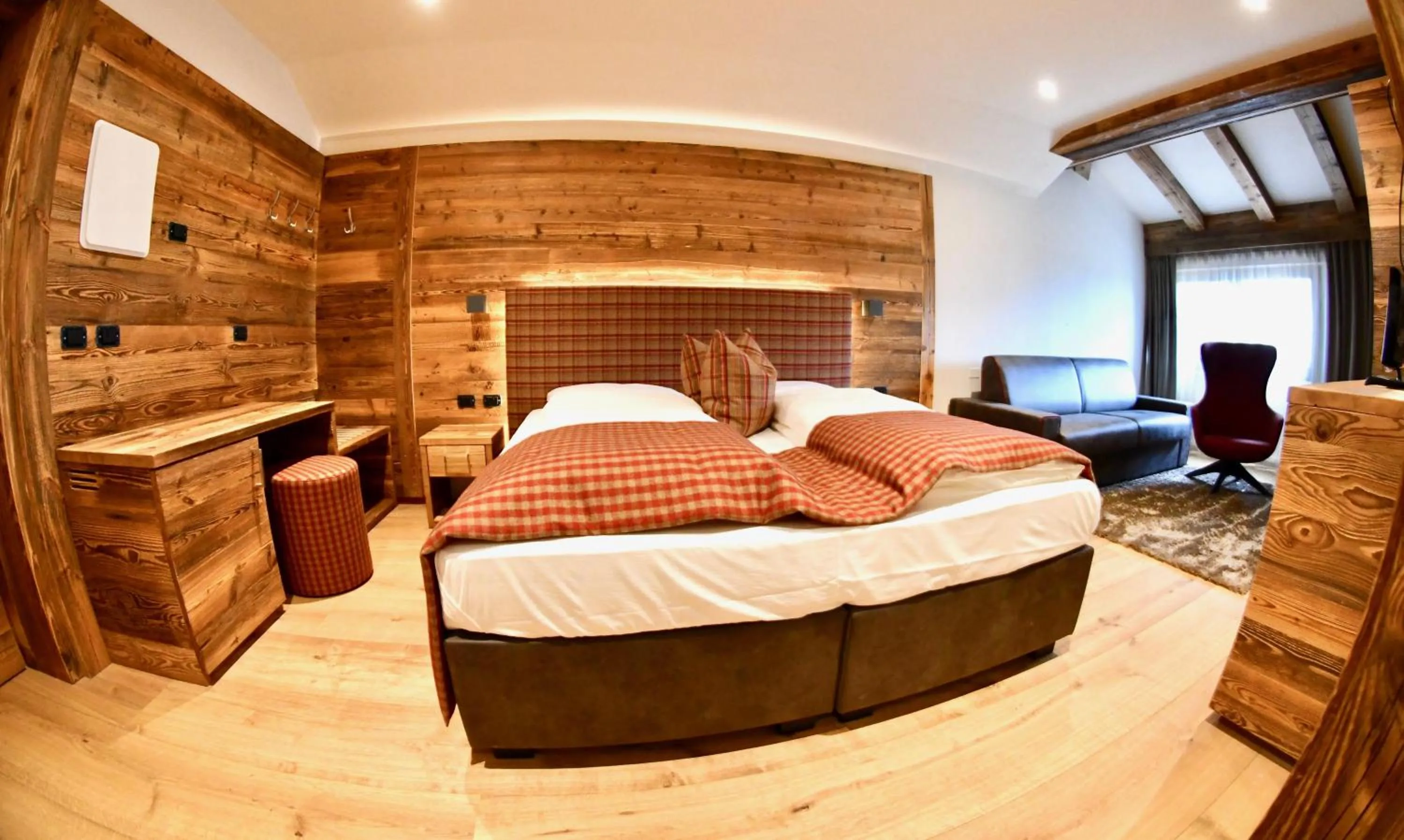 Living room, Bed in Hotel Alpenrose Wellness