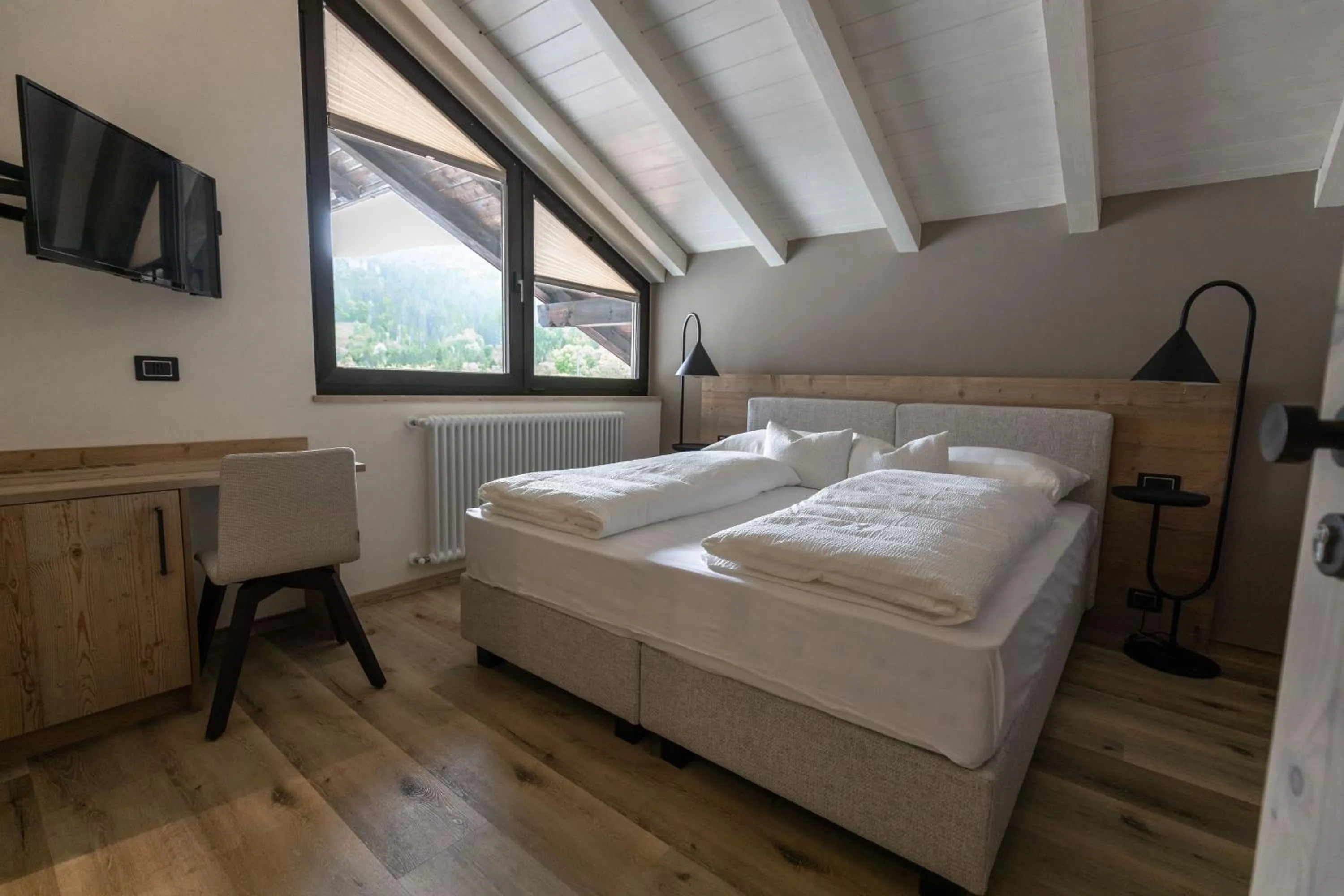 Bed in Hotel Alpenrose Wellness