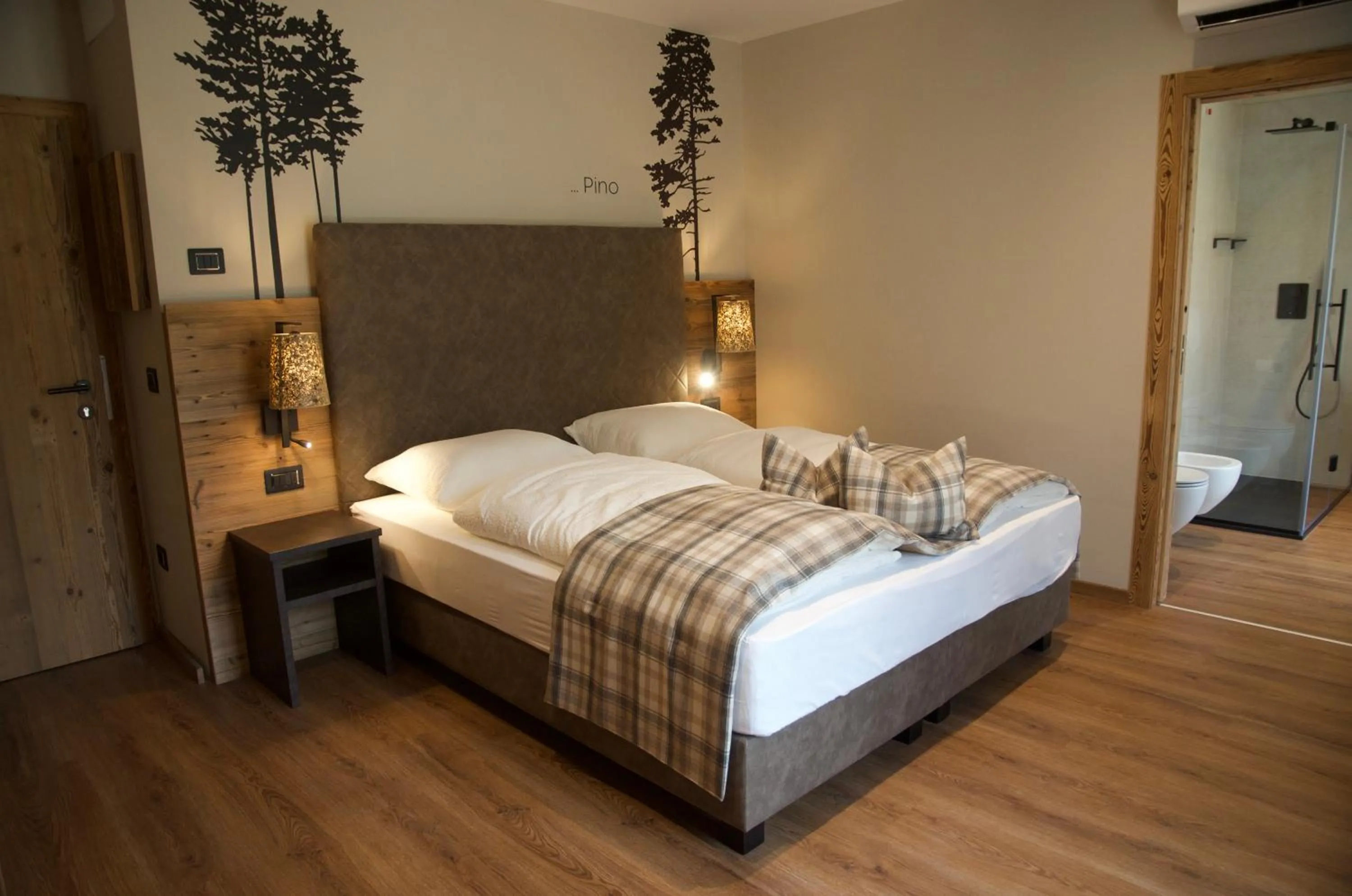 Bed in Hotel Alpenrose Wellness