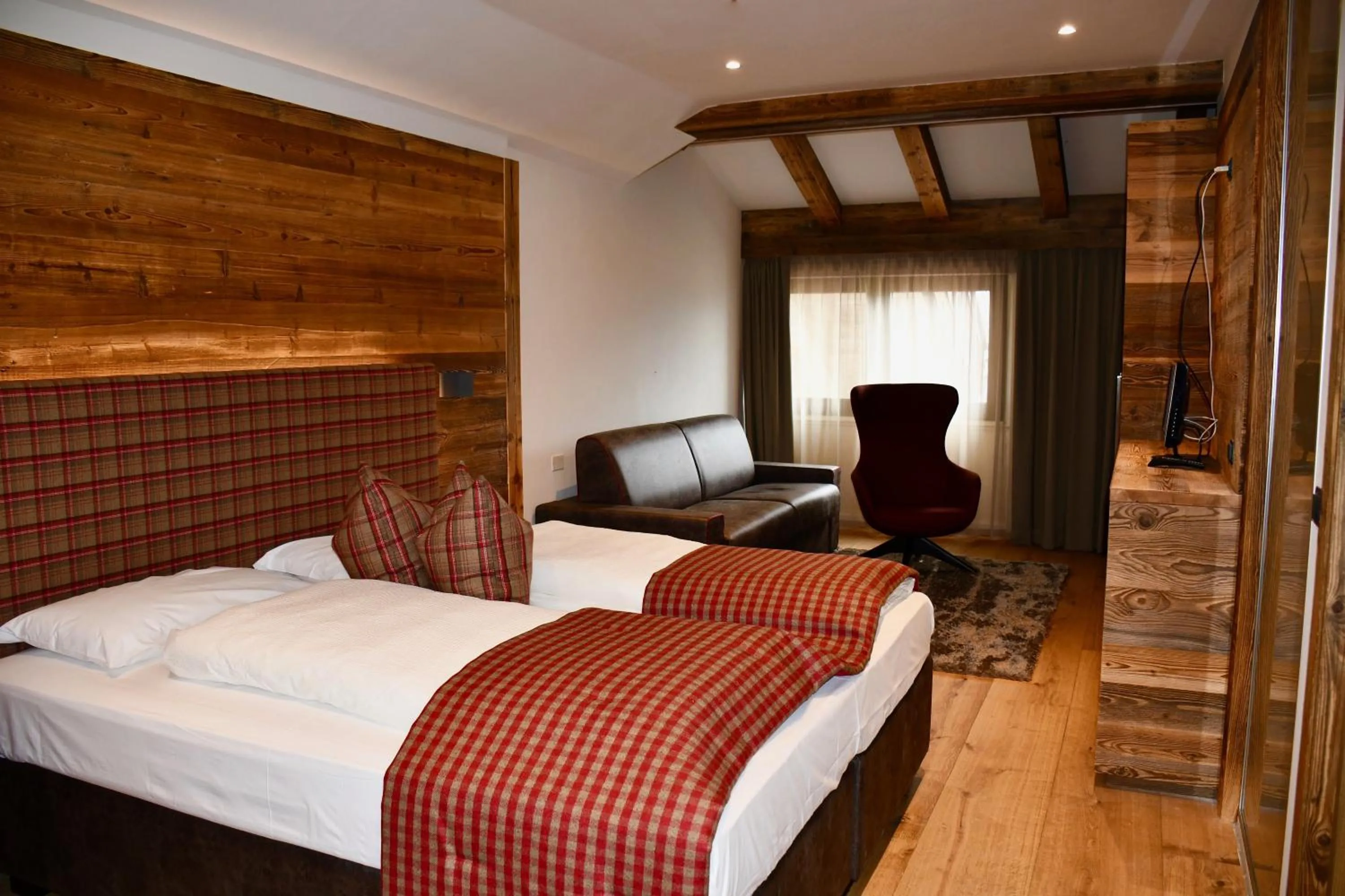 Bed in Hotel Alpenrose Wellness