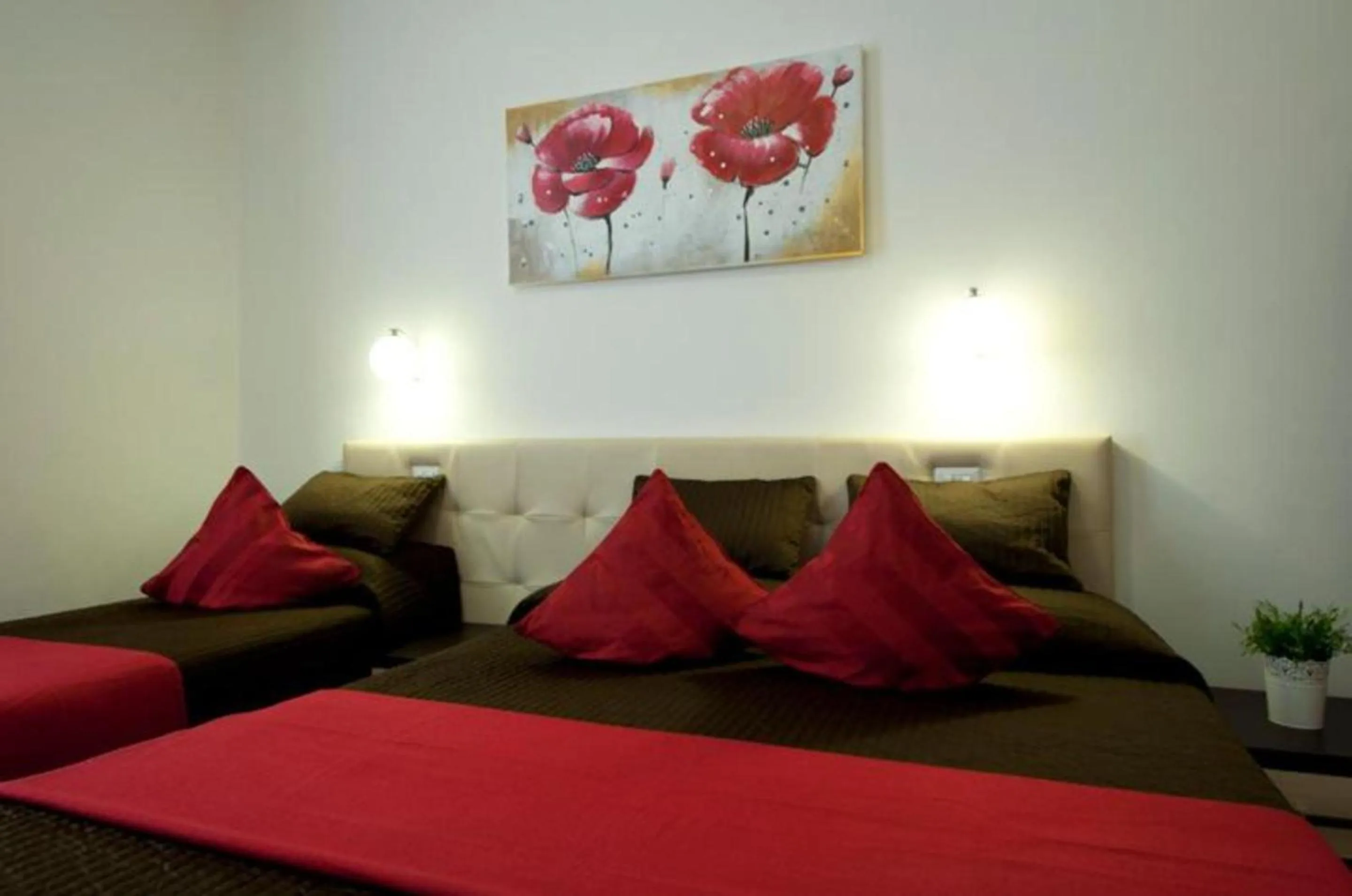 Bed in Ara Pacis Inn