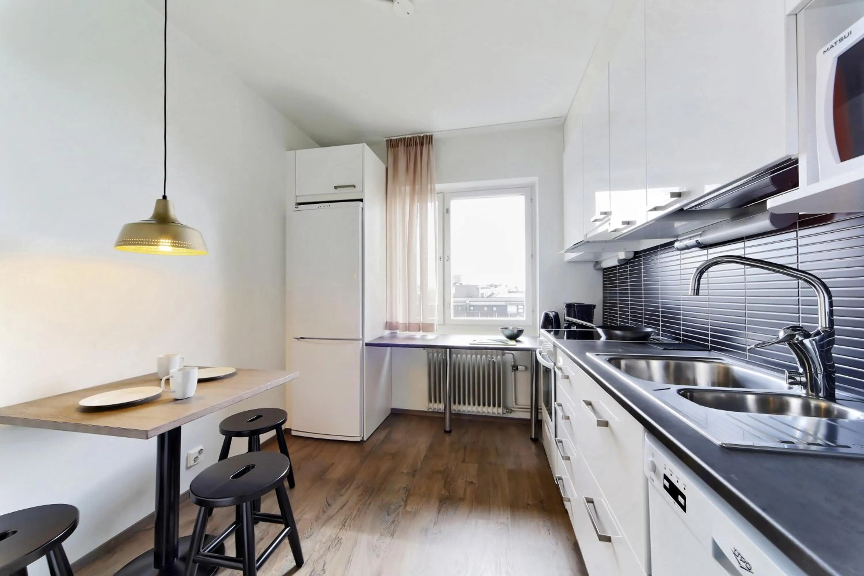 Kitchen or kitchenette in Forenom Serviced Apartments Helsinki Lapinlahdenkatu