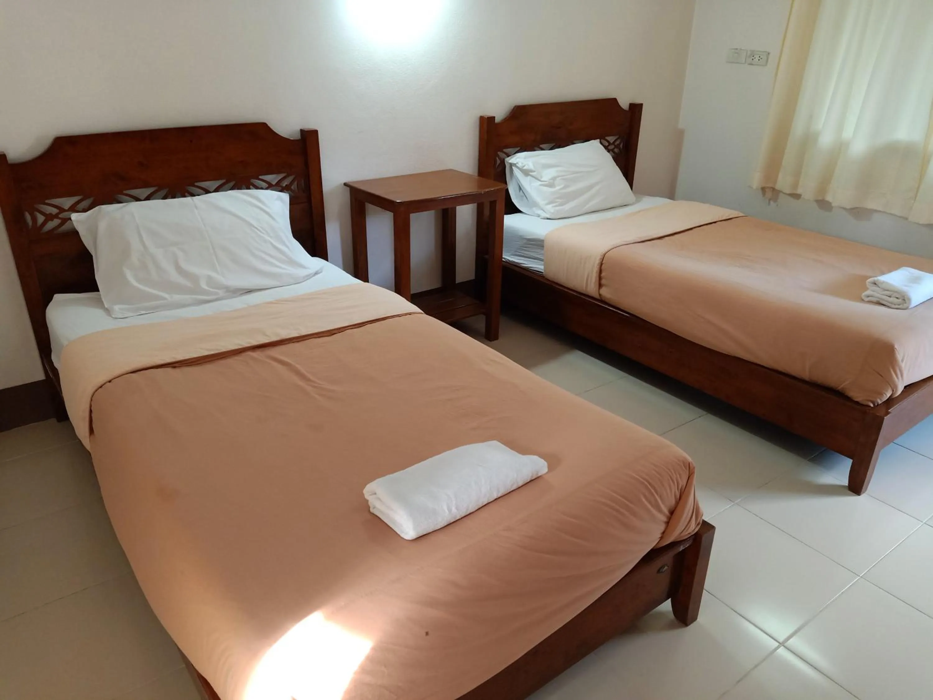 Bed in Phumchan Place Hotel