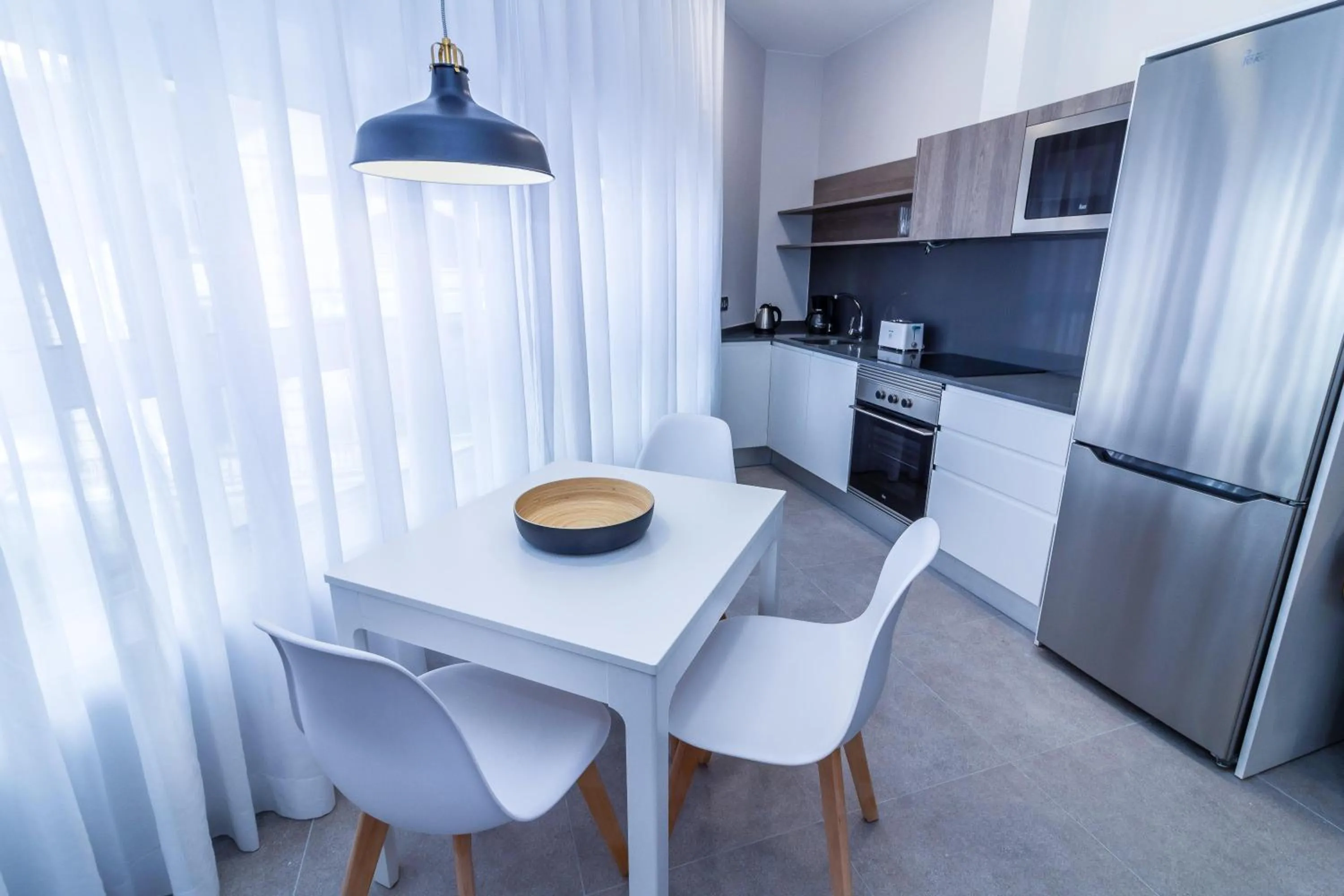 Kitchen or kitchenette in URBANSEA Holiday Homes
