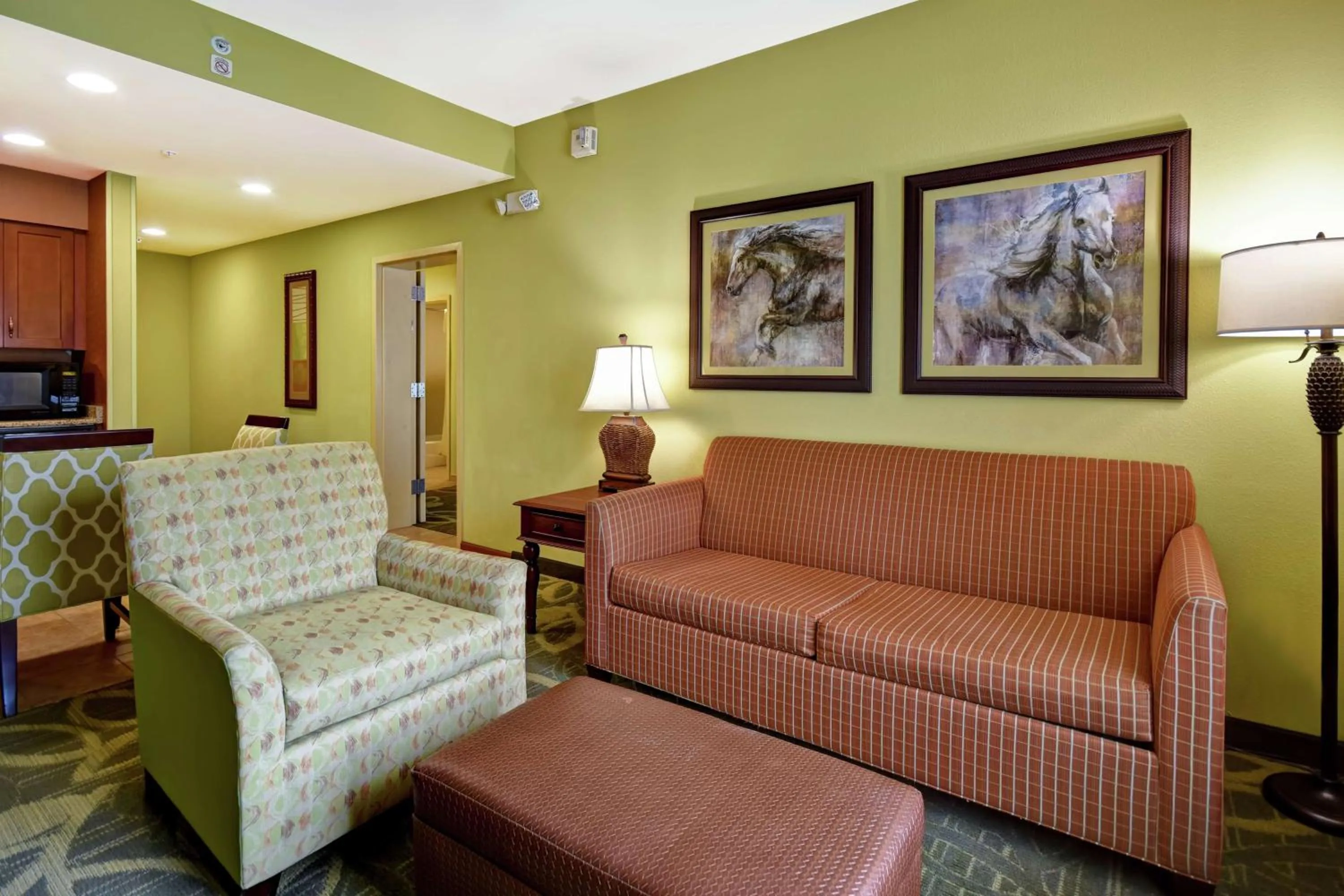 Living room in Homewood Suites by Hilton Ocala at Heath Brook