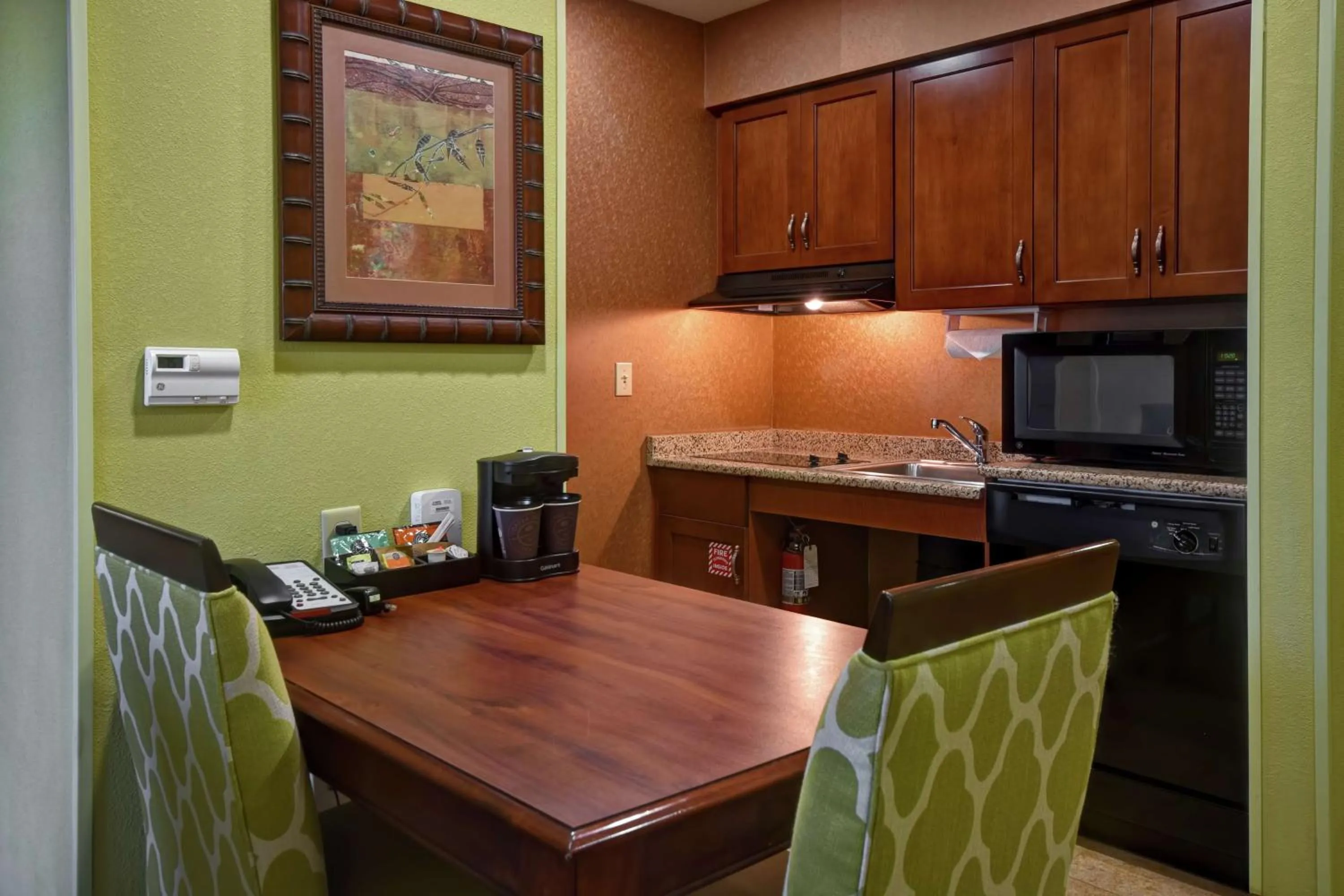 Kitchen or kitchenette in Homewood Suites by Hilton Ocala at Heath Brook