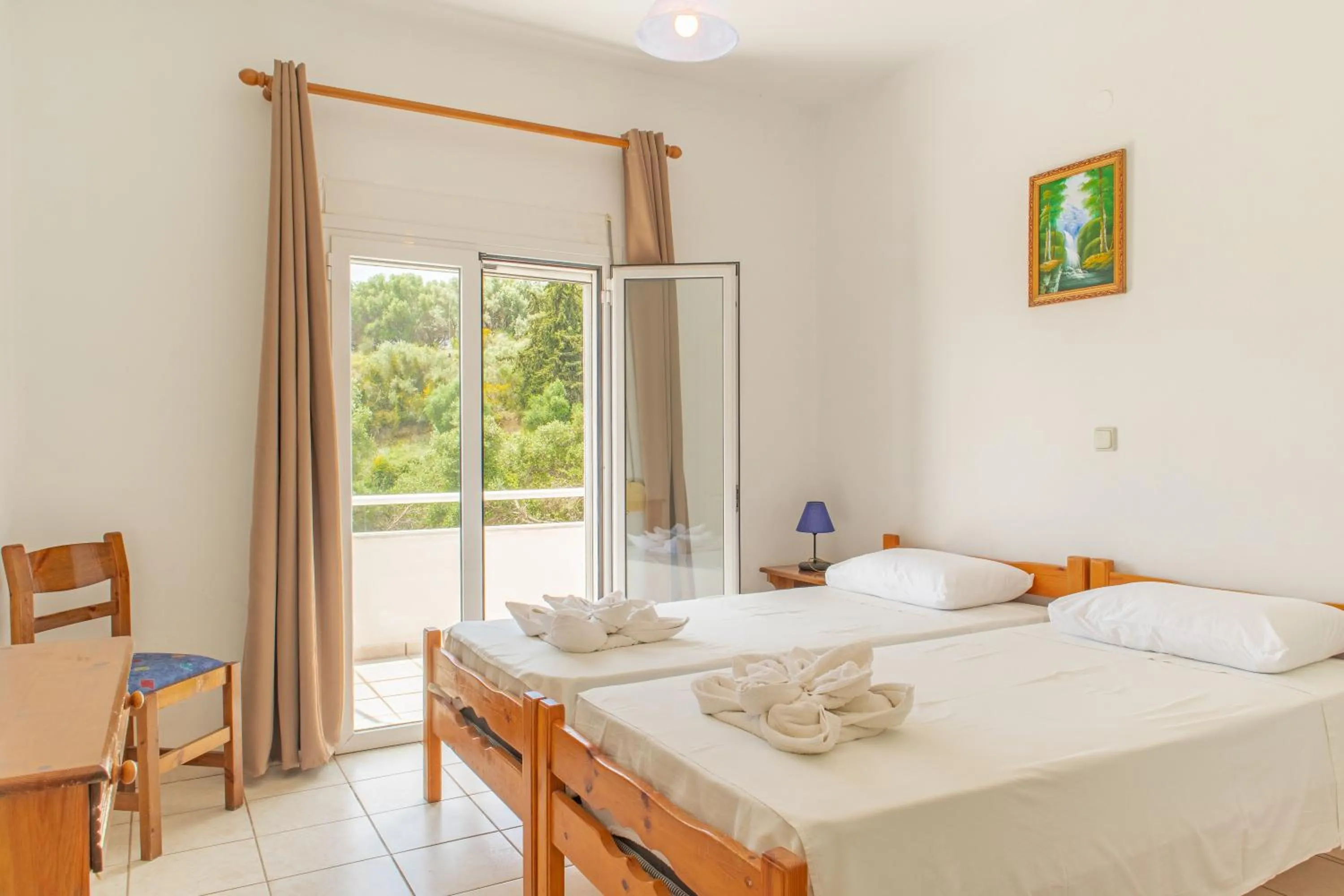 Bed in Amazona Apartments and Studios