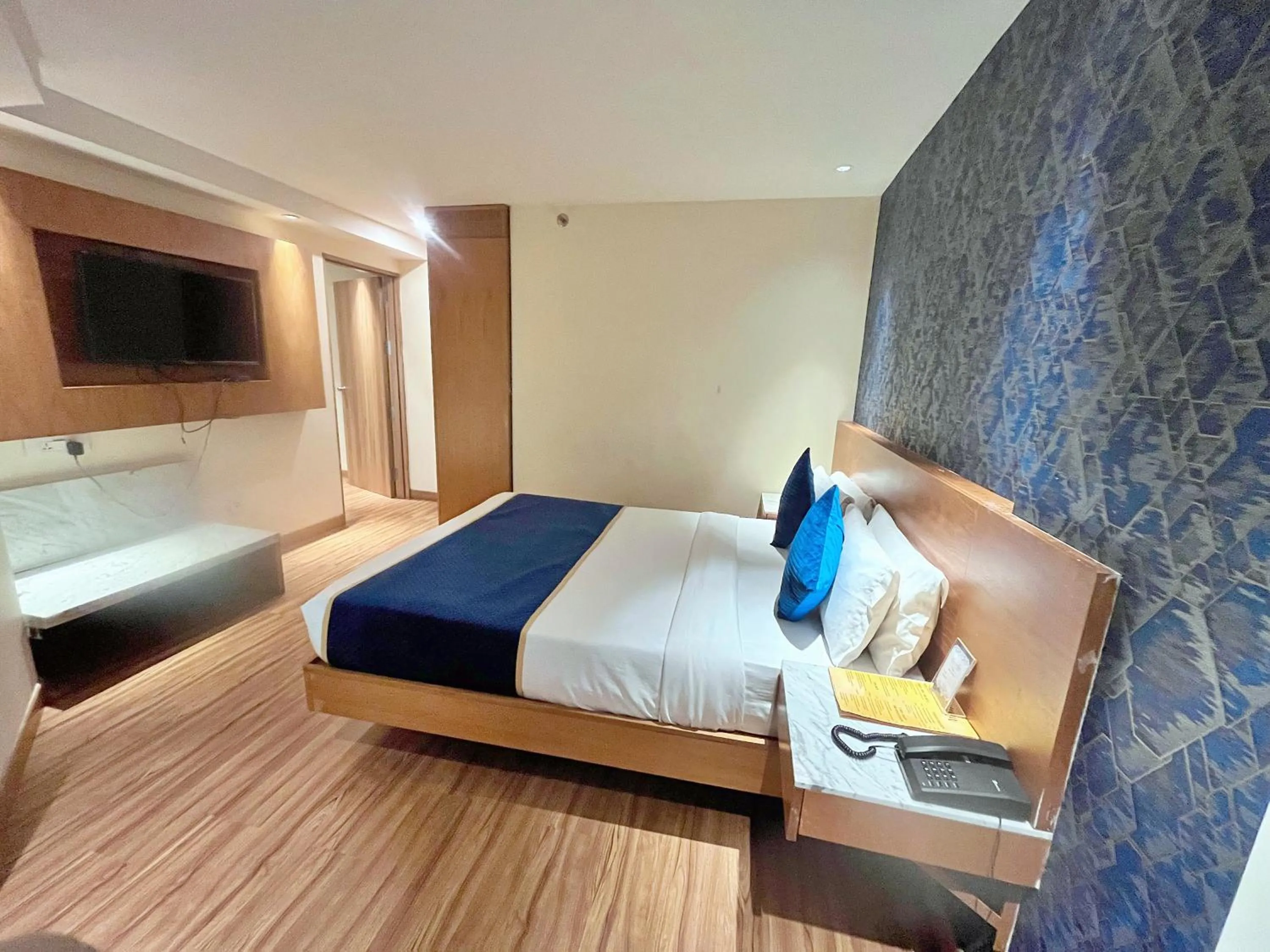 Photo of the whole room, Bed in The Orion Plaza - Nehru Place