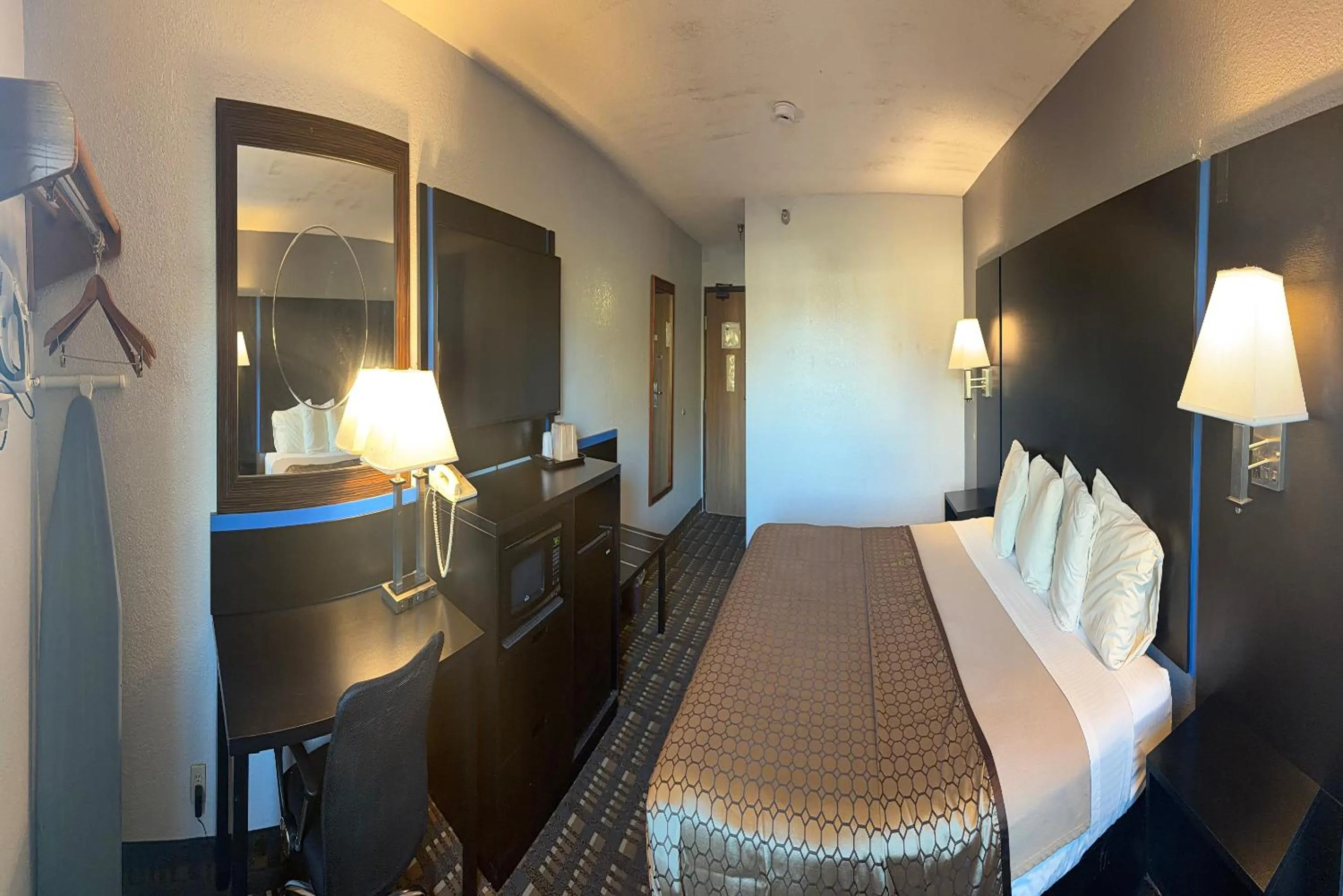 Bed in Coratel Inn and Suites by Jasper Stillwater