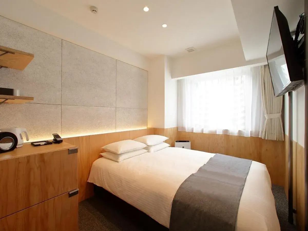 Bed in Hotel Oriental Express Tokyo Kamata Bed in Hotel Oriental Express Tokyo Kamata