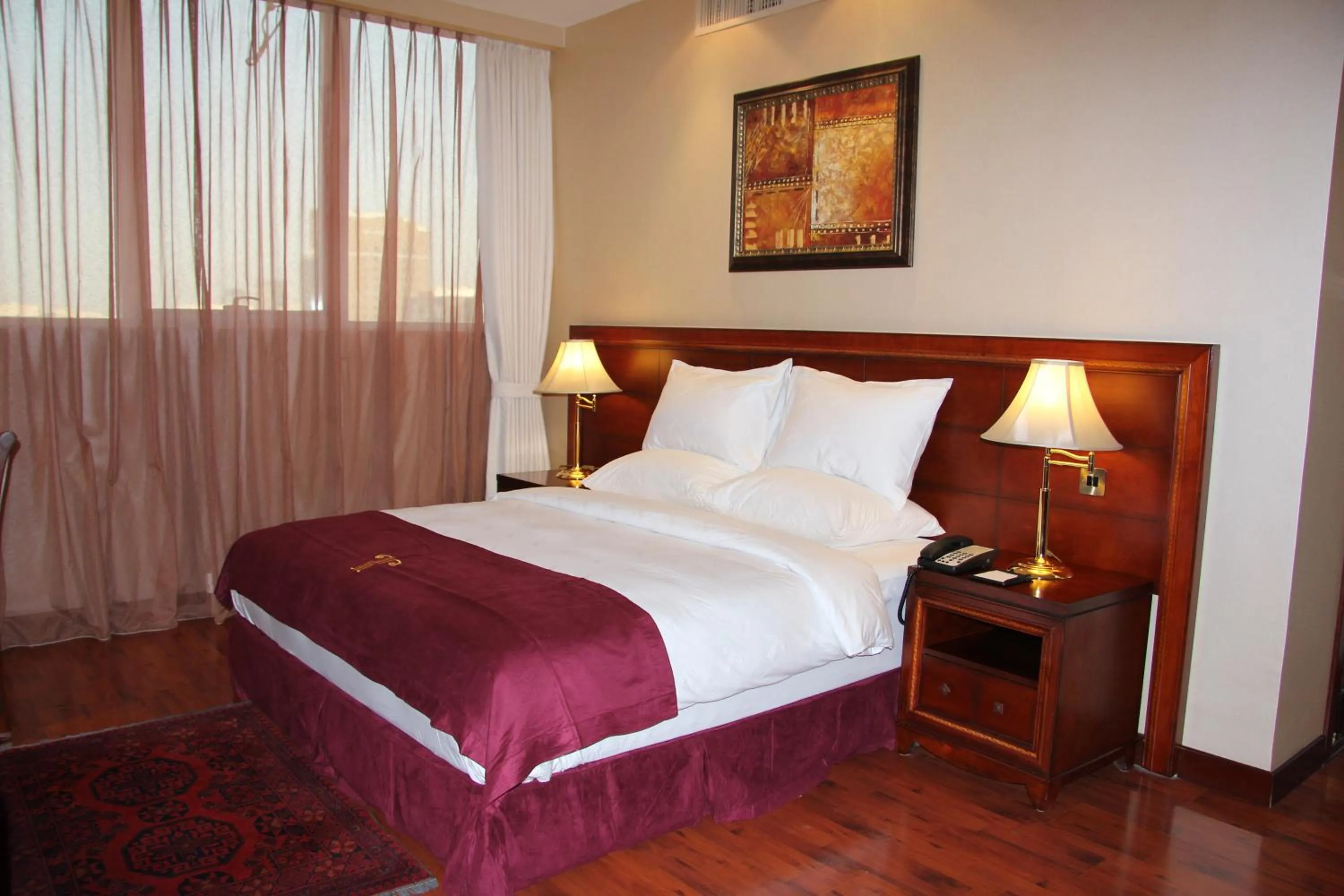 Bed in TRIANON ROYAL HOTEL