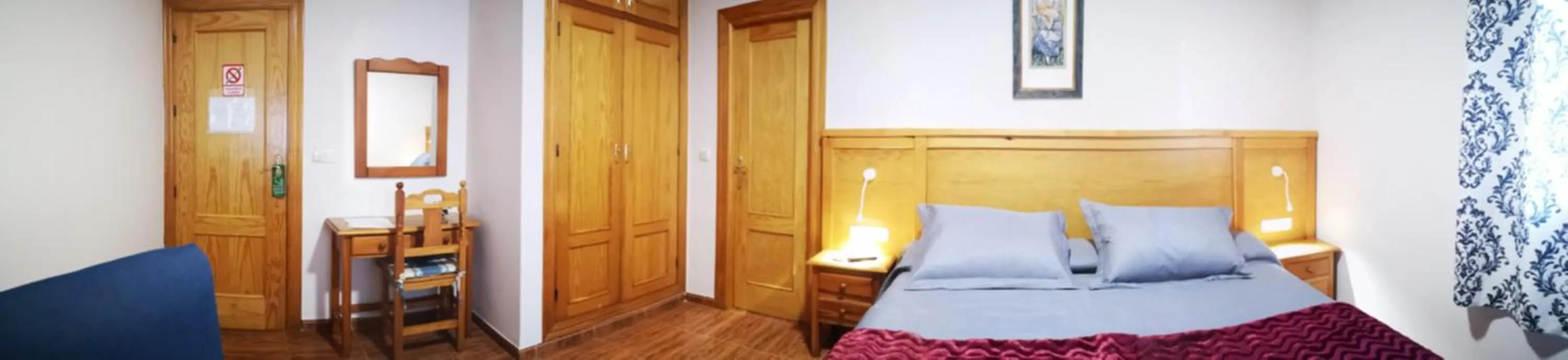 Bed in Hostal Los Hermanos