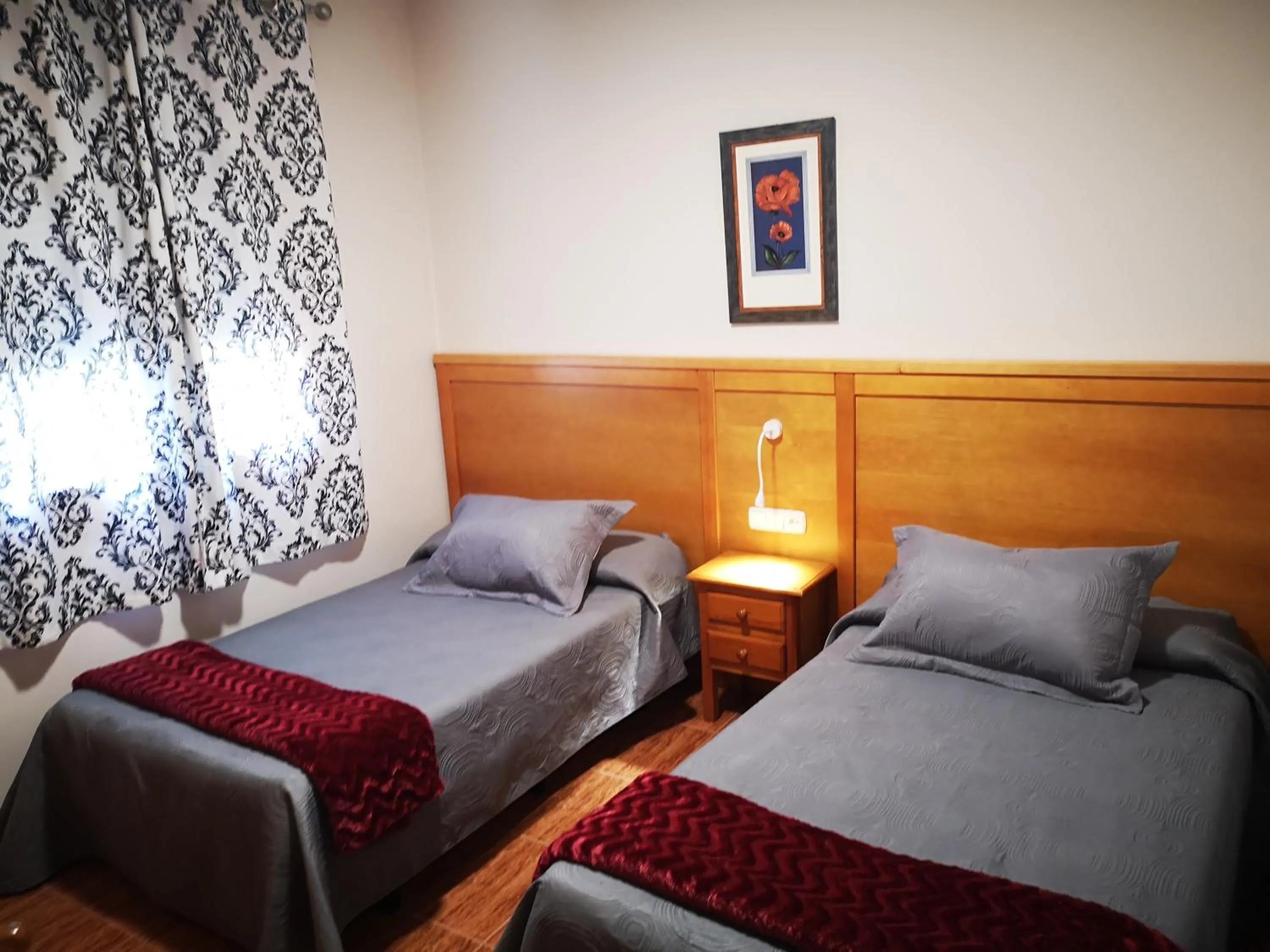 Bed in Hostal Los Hermanos