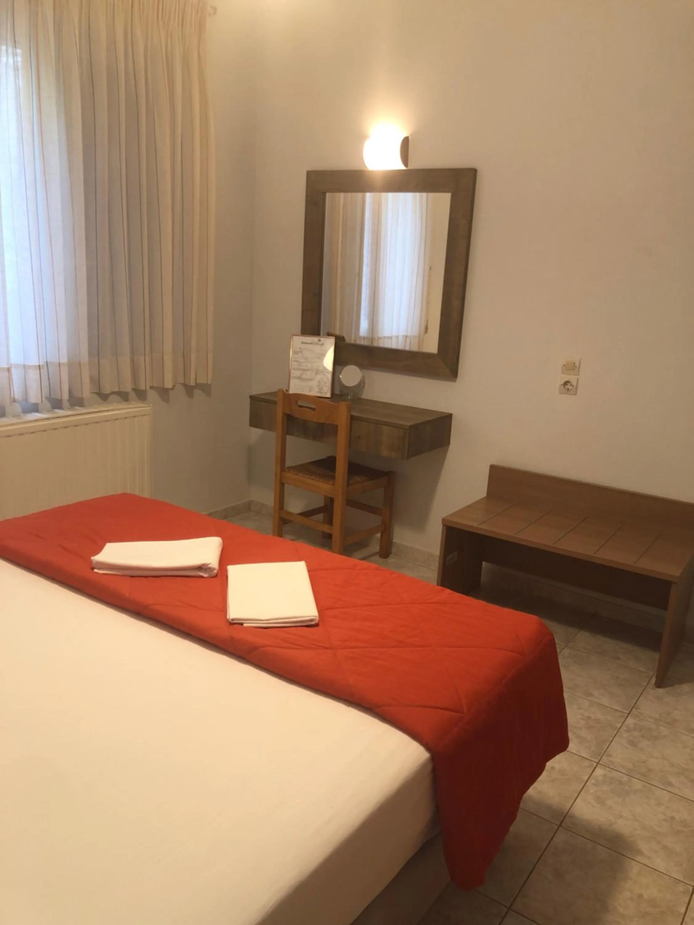 Bed in Chrisanthi Studios & Apartments