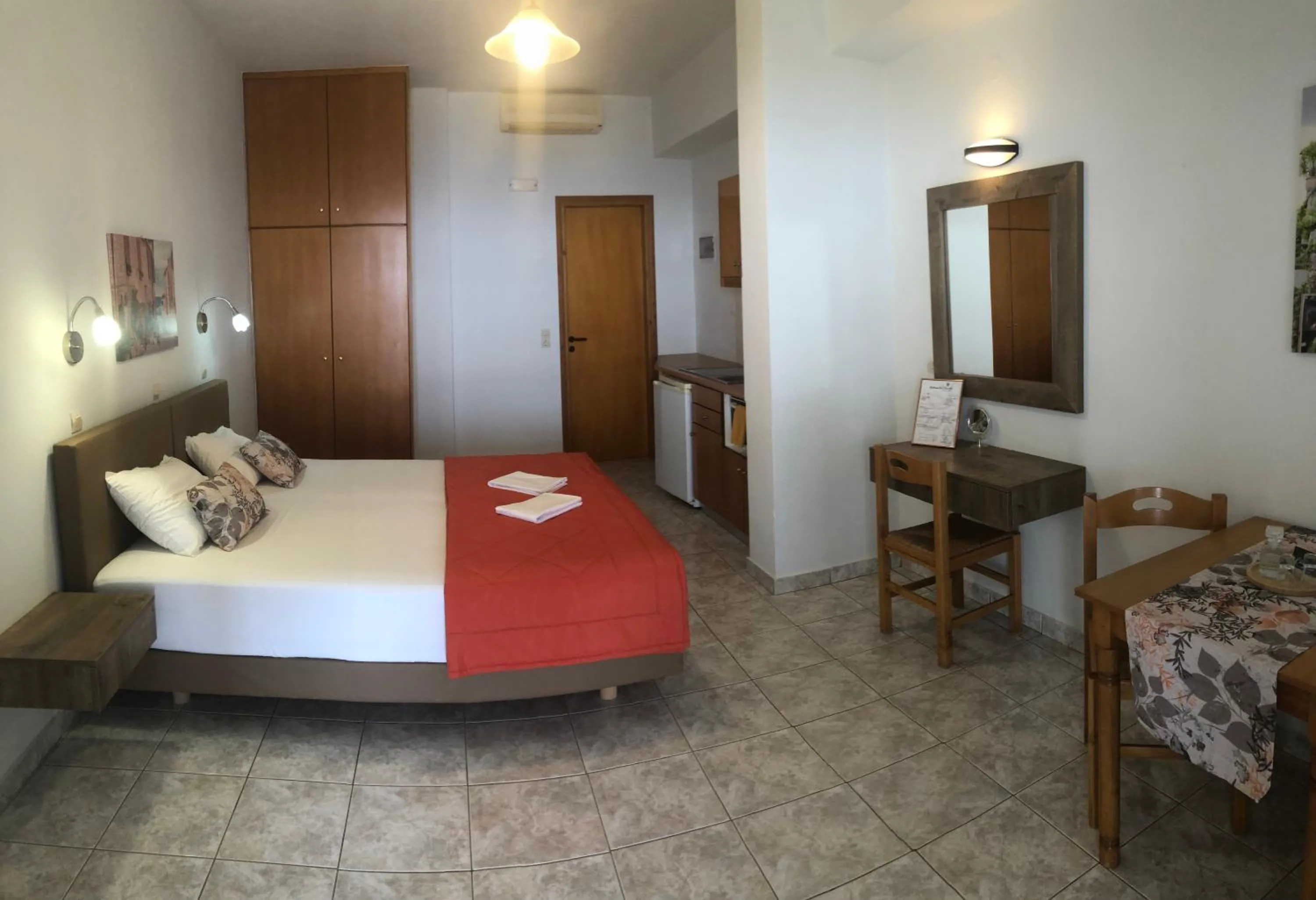 Dining area, Bed in Chrisanthi Studios & Apartments